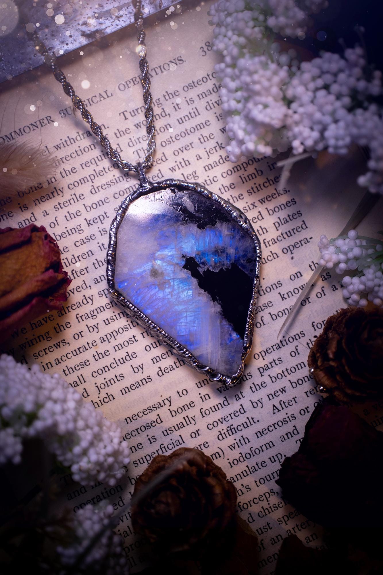 Handmade and beautiful, rainbow moonstone slab, soft soldered pendant necklace. This pendant necklace features the most gorgeous and flashy rainbow moonstone slab crystal, full of glittery shimmer and a deep lovely blue hue. Handcrafted using the soft solder method, also known as the tiffany technique, an ancient technique used to created stained glass windows. The solder used is lead free and totally safe to wear, it contains elements of silver and polishes up to a high lustre. Gothic jewellery