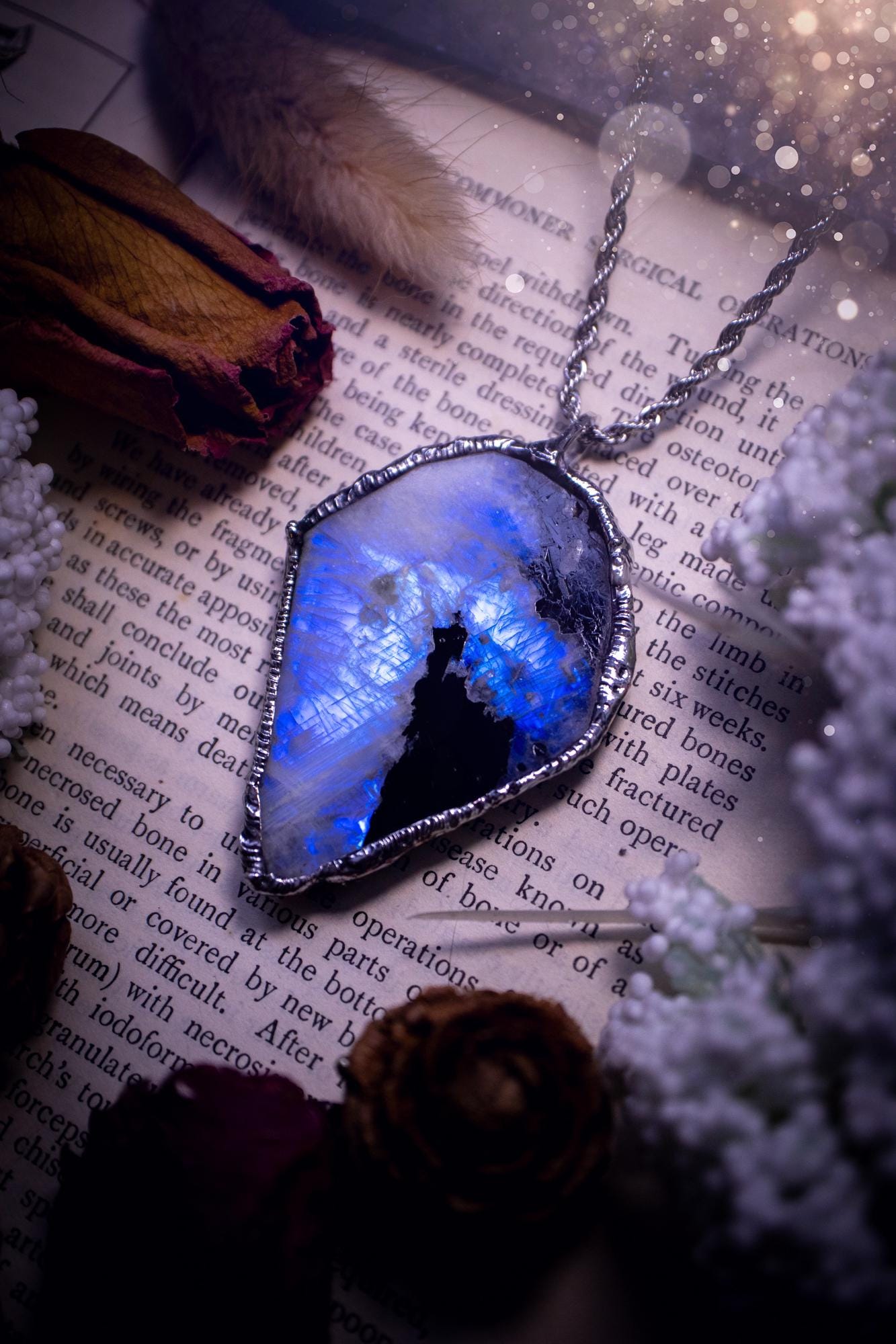 Handmade and beautiful, rainbow moonstone slab, soft soldered pendant necklace. This pendant necklace features the most gorgeous and flashy rainbow moonstone slab crystal, full of glittery shimmer and a deep lovely blue hue. Handcrafted using the soft solder method, also known as the tiffany technique, an ancient technique used to created stained glass windows. The solder used is lead free and totally safe to wear, it contains elements of silver and polishes up to a high lustre. Gothic jewellery