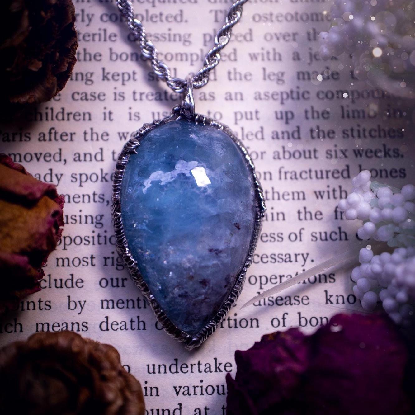 Beautiful and gemmy, large aquamarine soft soldered pendant necklace. This pendant feature the most gemmy, deep blue aquamarine crystal and is full of flash with shimmer! Handmade using the tiffany technique, also known as soft soldering. This piece is made from solder which contains metals and silver and is safe to wear. The ideal gift for any jewellery lover and crystal collector! Witchy, gothic and hippy jewellery that has been made for the soul.