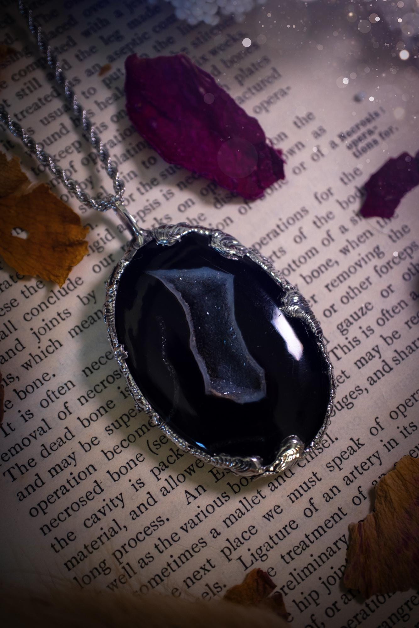 Beautiful and handcrafted, black druzy agate, crystal pendant necklace. This one of a kind piece of jewellery has been hand made using the tiffany technique, also known as soft soldering. The bezel is made with a solder that is lead free and contains elements of silver so when polished a high lustre is achieved. Featuring a large druzy agate with beautiful sparkle and banding. This is the ideal gift for any crystal or jewellery lover that likes a gothic and witchy vibe and aesthetic.