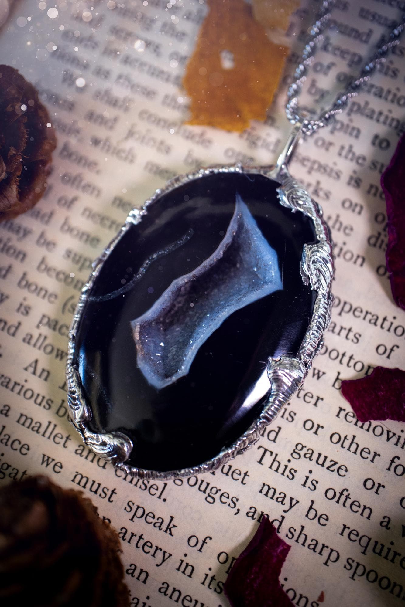 Beautiful and handcrafted, black druzy agate, crystal pendant necklace. This one of a kind piece of jewellery has been hand made using the tiffany technique, also known as soft soldering. The bezel is made with a solder that is lead free and contains elements of silver so when polished a high lustre is achieved. Featuring a large druzy agate with beautiful sparkle and banding. This is the ideal gift for any crystal or jewellery lover that likes a gothic and witchy vibe and aesthetic.