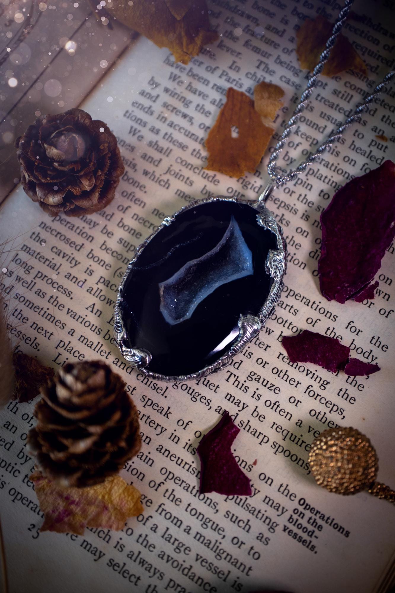 Beautiful and handcrafted, black druzy agate, crystal pendant necklace. This one of a kind piece of jewellery has been hand made using the tiffany technique, also known as soft soldering. The bezel is made with a solder that is lead free and contains elements of silver so when polished a high lustre is achieved. Featuring a large druzy agate with beautiful sparkle and banding. This is the ideal gift for any crystal or jewellery lover that likes a gothic and witchy vibe and aesthetic.