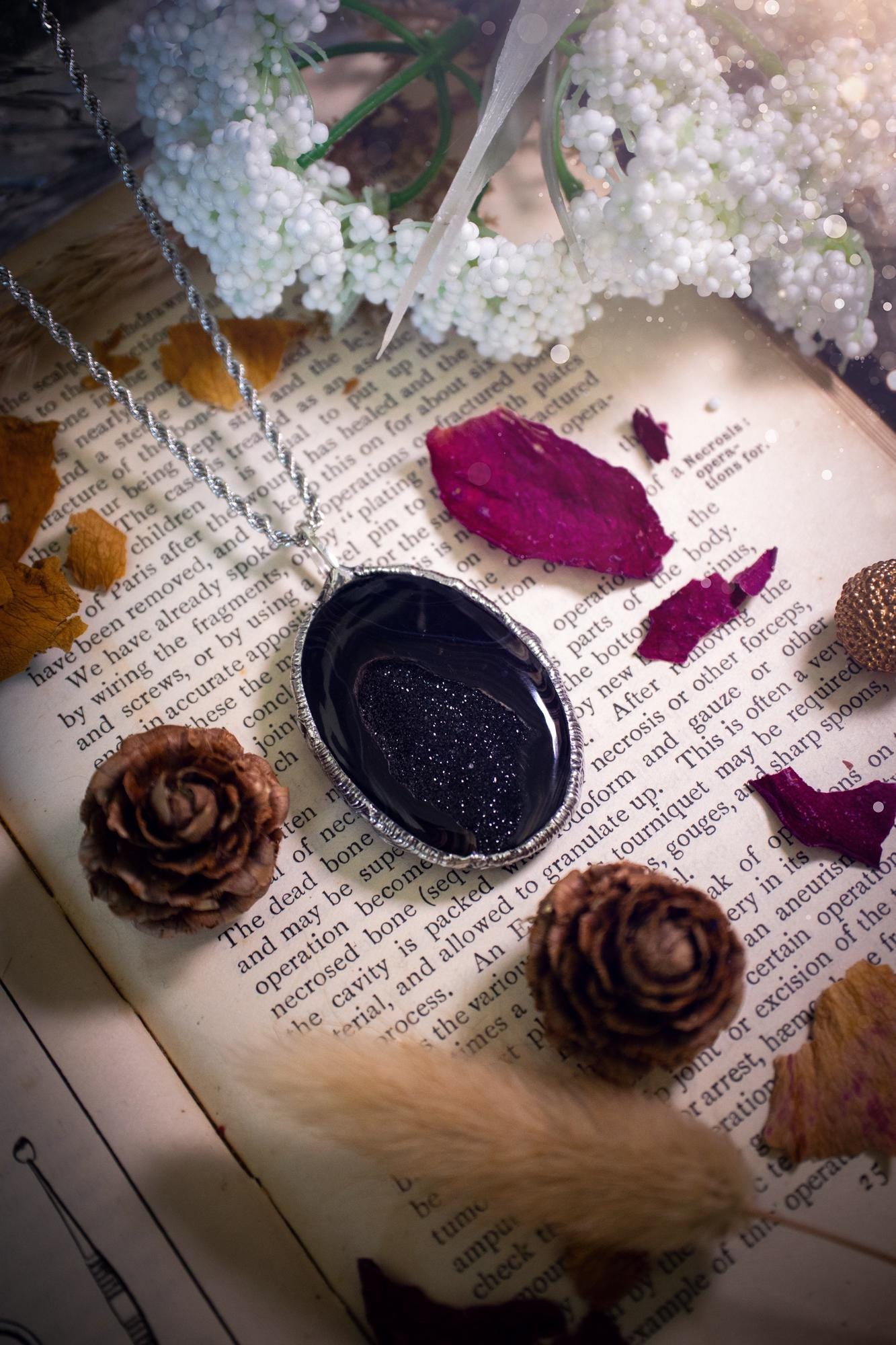 Beautiful and handcrafted, black druzy agate, crystal pendant necklace. This one of a kind piece of jewellery has been hand made using the tiffany technique, also known as soft soldering. The bezel is made with a solder that is lead free and contains elements of silver so when polished a high lustre is achieved. Featuring a large druzy agate with beautiful sparkle and banding. This is the ideal gift for any crystal or jewellery lover that likes a gothic and witchy vibe and aesthetic.