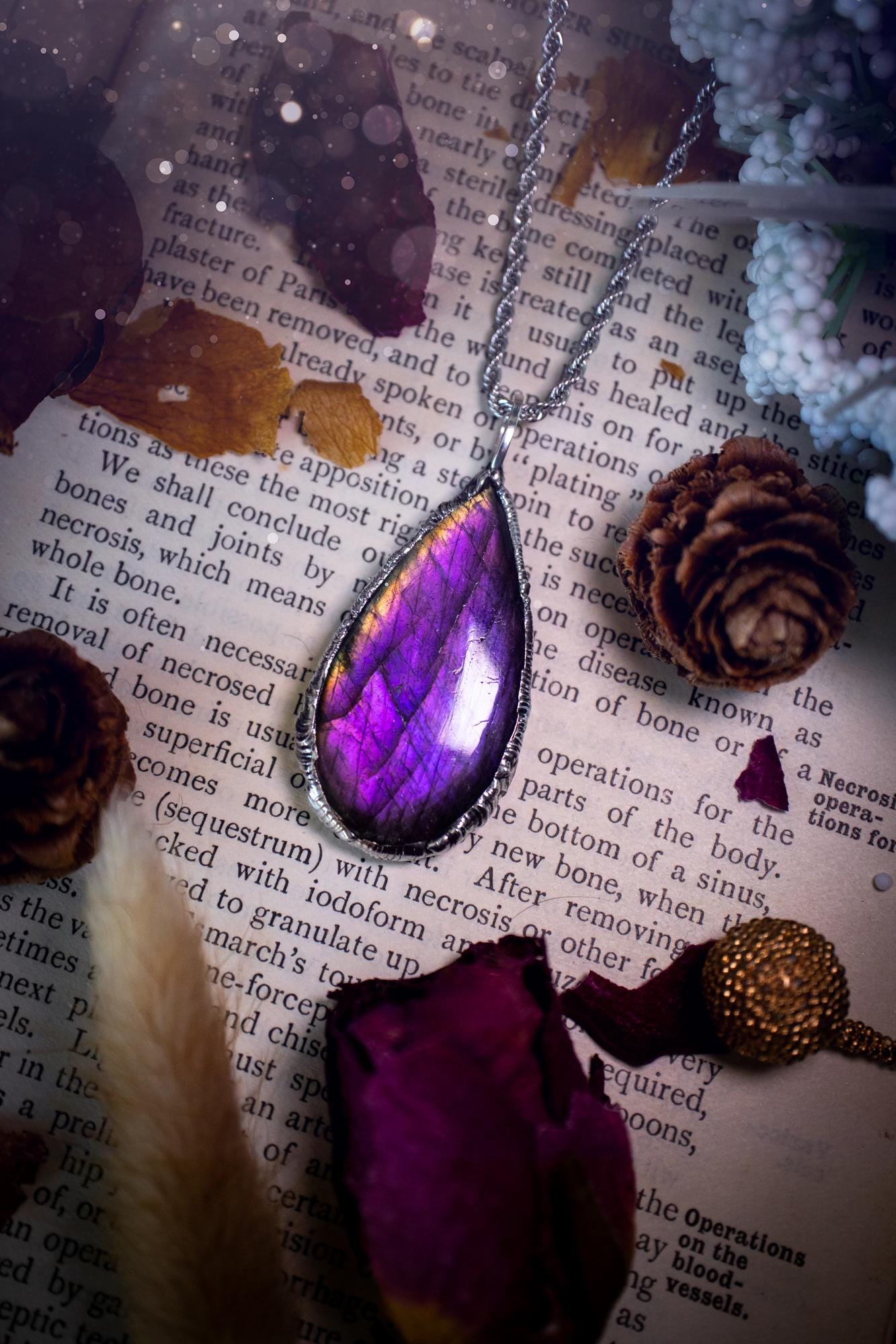 A beautiful, one of a kind, purple, green and grey multi-flash Labradorite crystal pendant necklace. This pendant has been handmade using the soft solder method, also known as the tiffany technique used to create stained glass windows. Featuring the most stunning and natural Labradorite crystal which is full of purple and green hues. The pendant is suitable for gifting to any jewellery or crystal lover, or to simply add to your own collection. One of a kind jewellery, gothic and witchy gifts