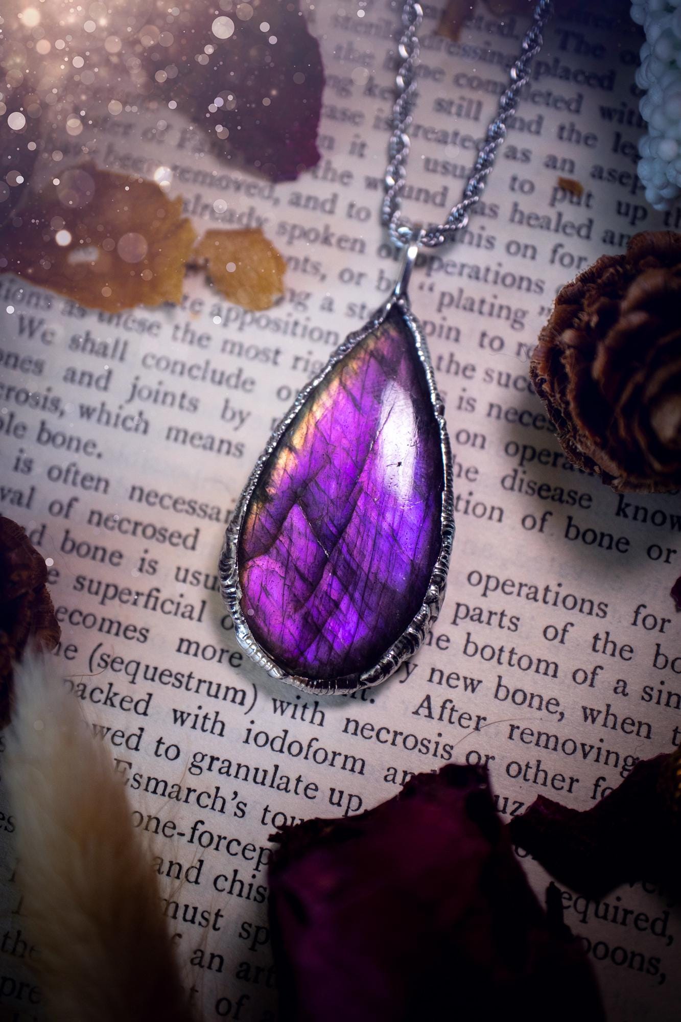 A beautiful, one of a kind, purple, green and grey multi-flash Labradorite crystal pendant necklace. This pendant has been handmade using the soft solder method, also known as the tiffany technique used to create stained glass windows. Featuring the most stunning and natural Labradorite crystal which is full of purple and green hues. The pendant is suitable for gifting to any jewellery or crystal lover, or to simply add to your own collection. One of a kind jewellery, gothic and witchy gifts