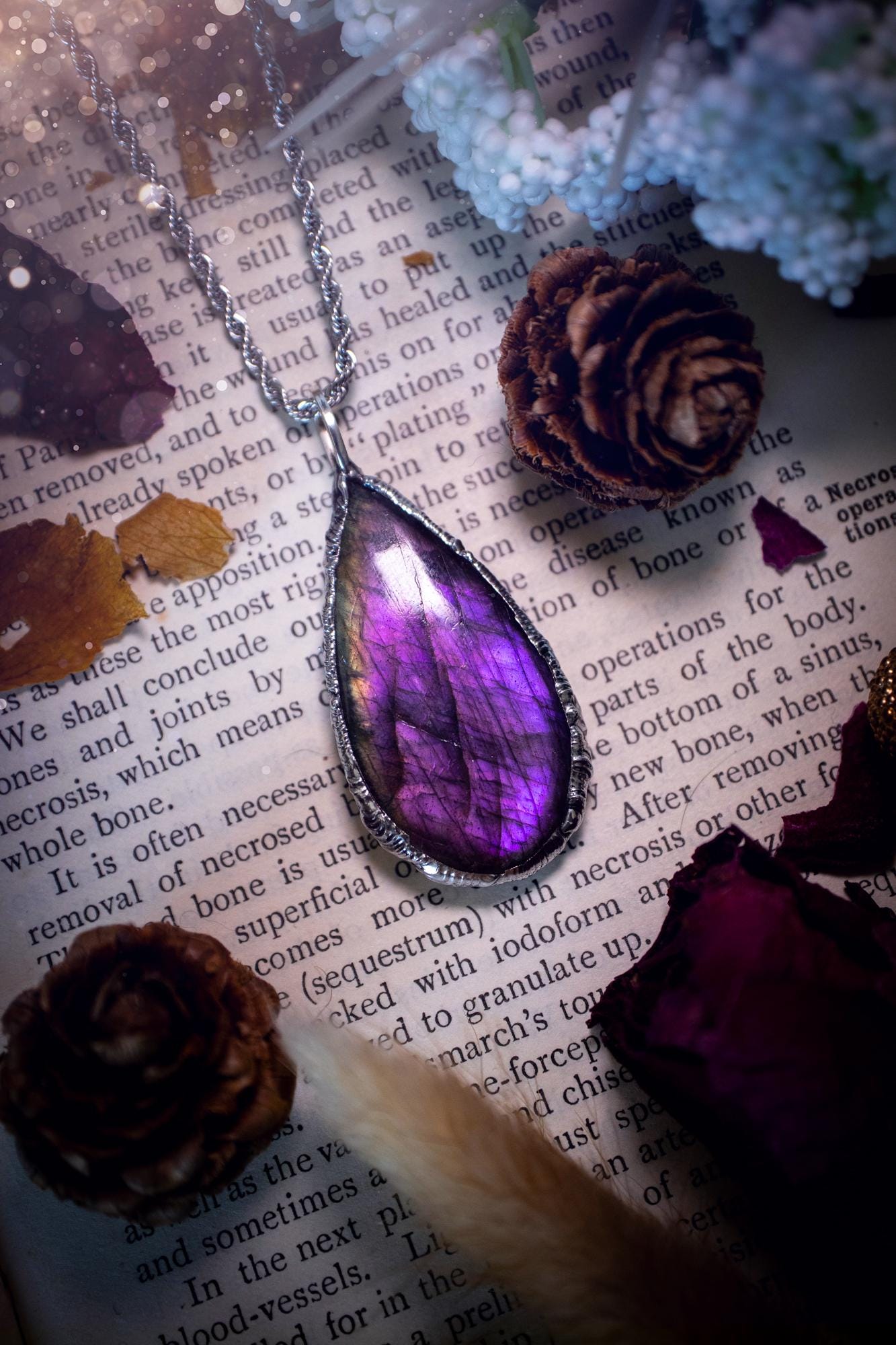 A beautiful, one of a kind, purple, green and grey multi-flash Labradorite crystal pendant necklace. This pendant has been handmade using the soft solder method, also known as the tiffany technique used to create stained glass windows. Featuring the most stunning and natural Labradorite crystal which is full of purple and green hues. The pendant is suitable for gifting to any jewellery or crystal lover, or to simply add to your own collection. One of a kind jewellery, gothic and witchy gifts