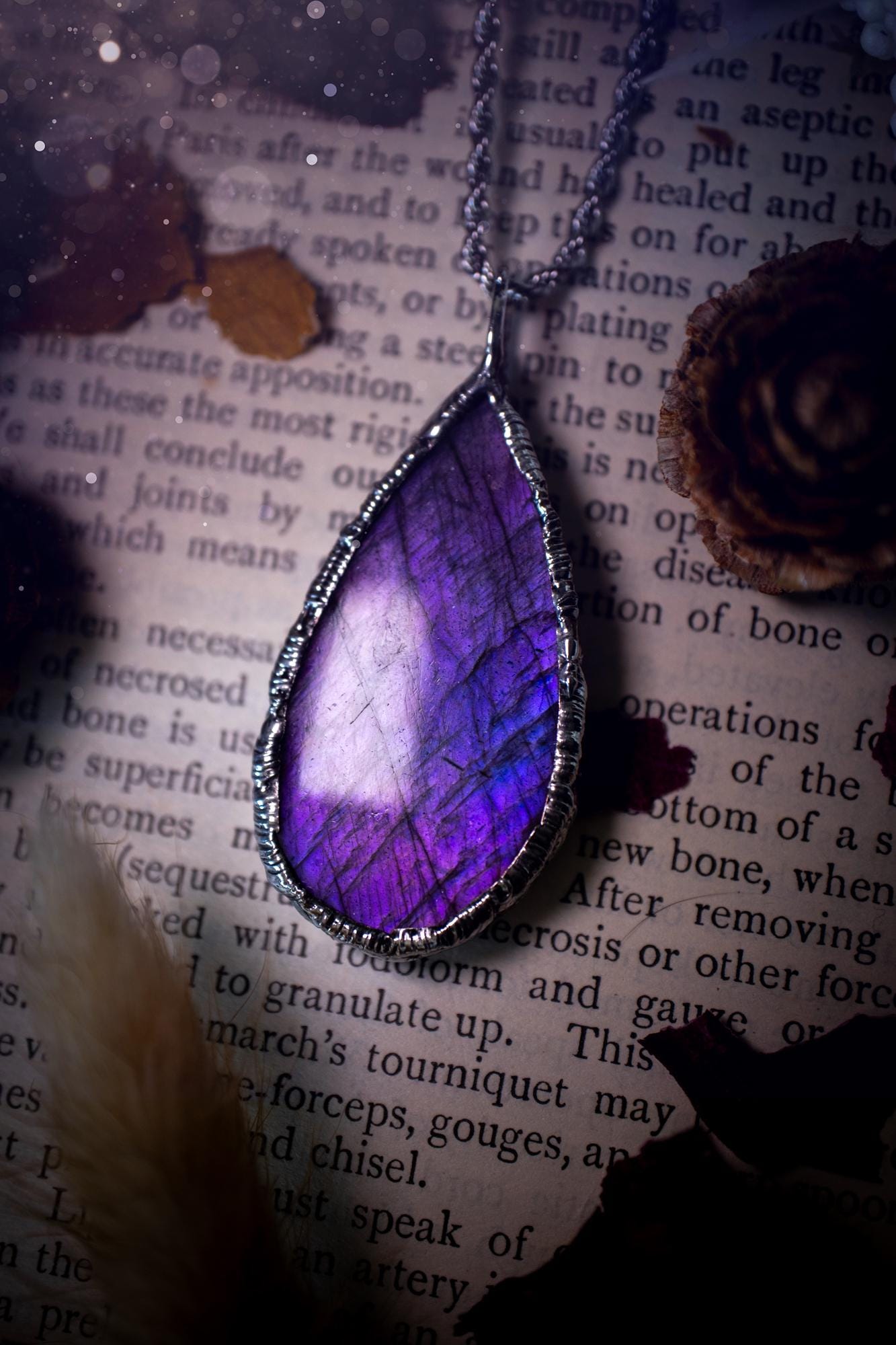 A beautiful, one of a kind, purple, green and grey multi-flash Labradorite crystal pendant necklace. This pendant has been handmade using the soft solder method, also known as the tiffany technique used to create stained glass windows. Featuring the most stunning and natural Labradorite crystal which is full of purple and green hues. The pendant is suitable for gifting to any jewellery or crystal lover, or to simply add to your own collection. One of a kind jewellery, gothic and witchy gifts