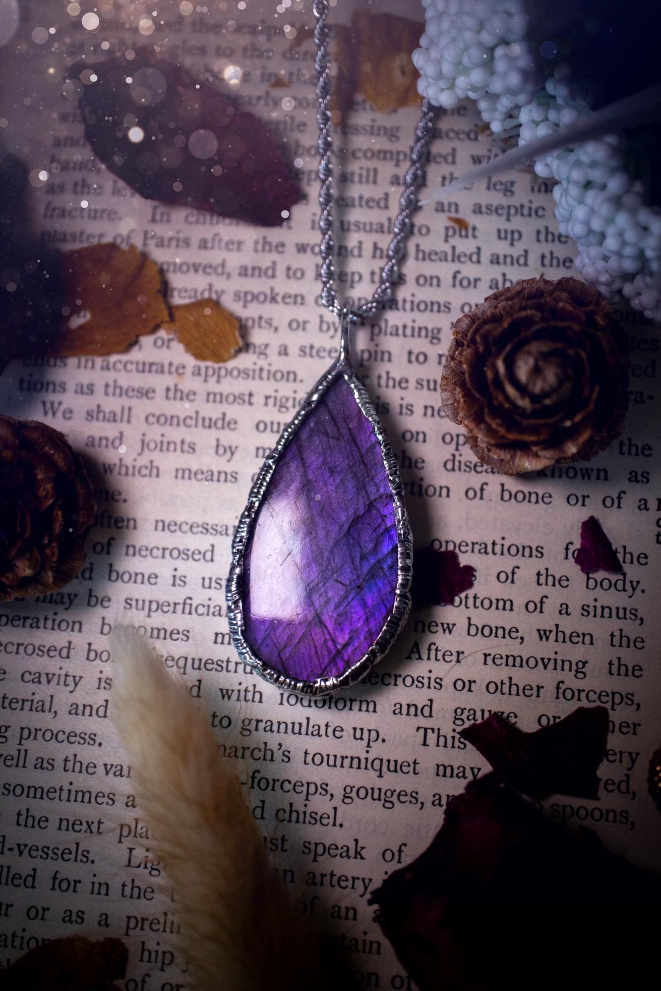 A beautiful, one of a kind, purple, green and grey multi-flash Labradorite crystal pendant necklace. This pendant has been handmade using the soft solder method, also known as the tiffany technique used to create stained glass windows. Featuring the most stunning and natural Labradorite crystal which is full of purple and green hues. The pendant is suitable for gifting to any jewellery or crystal lover, or to simply add to your own collection. One of a kind jewellery, gothic and witchy gifts