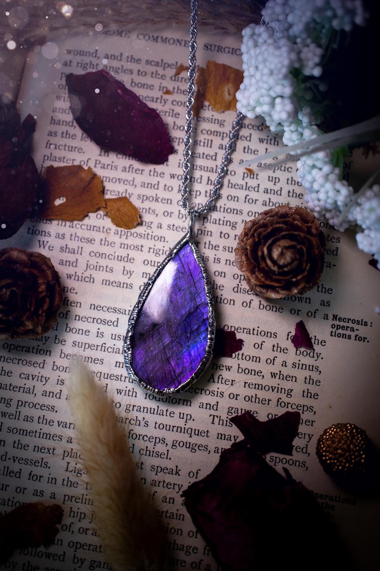 A beautiful, one of a kind, purple, green and grey multi-flash Labradorite crystal pendant necklace. This pendant has been handmade using the soft solder method, also known as the tiffany technique used to create stained glass windows. Featuring the most stunning and natural Labradorite crystal which is full of purple and green hues. The pendant is suitable for gifting to any jewellery or crystal lover, or to simply add to your own collection. One of a kind jewellery, gothic and witchy gifts