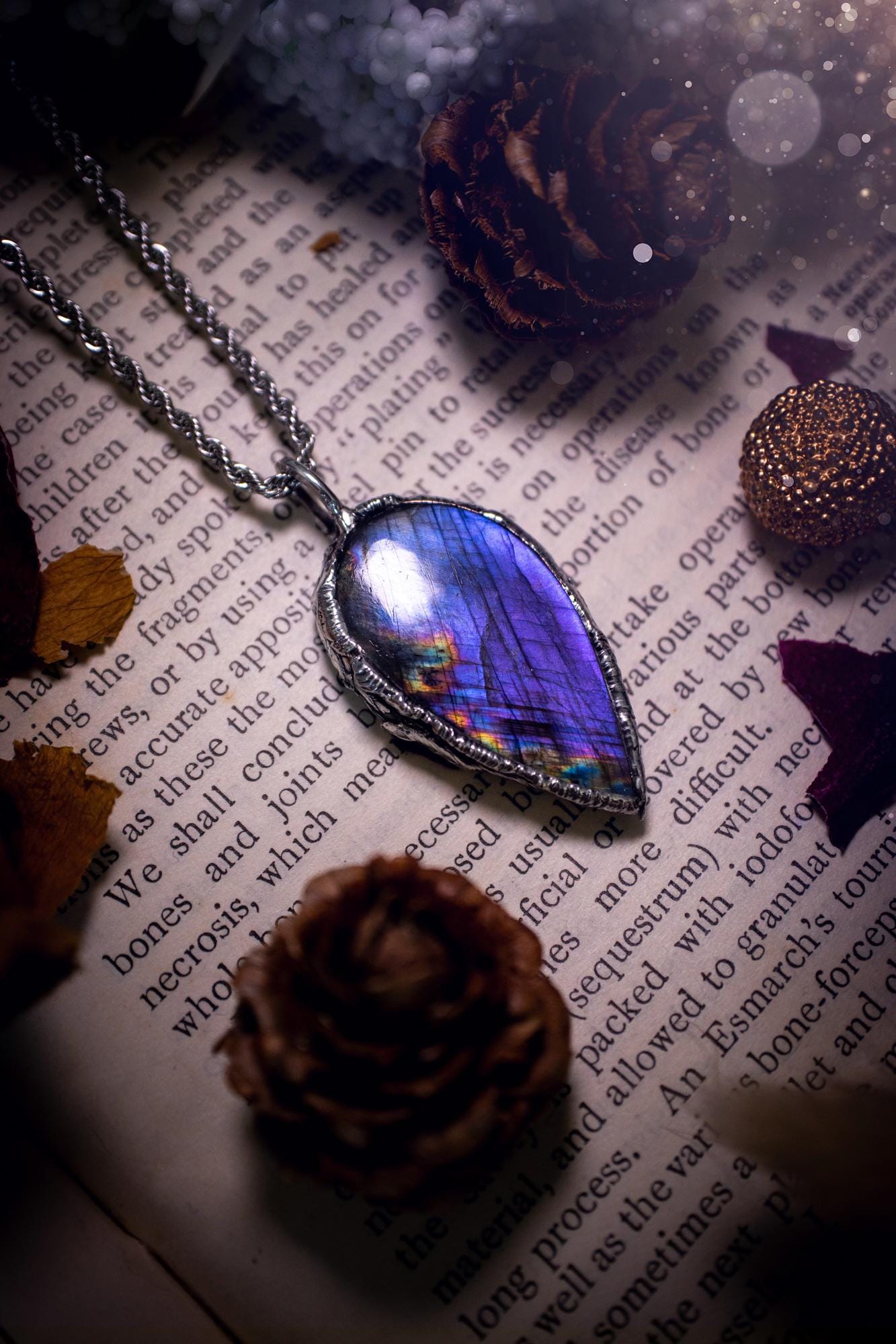 A beautiful, one of a kind, purple, green and grey multi-flash Labradorite crystal pendant necklace. This pendant has been handmade using the soft solder method, also known as the tiffany technique used to create stained glass windows. Featuring the most stunning and natural Labradorite crystal which is full of purple and green hues. The pendant is suitable for gifting to any jewellery or crystal lover, or to simply add to your own collection. One of a kind jewellery, gothic and witchy gifts