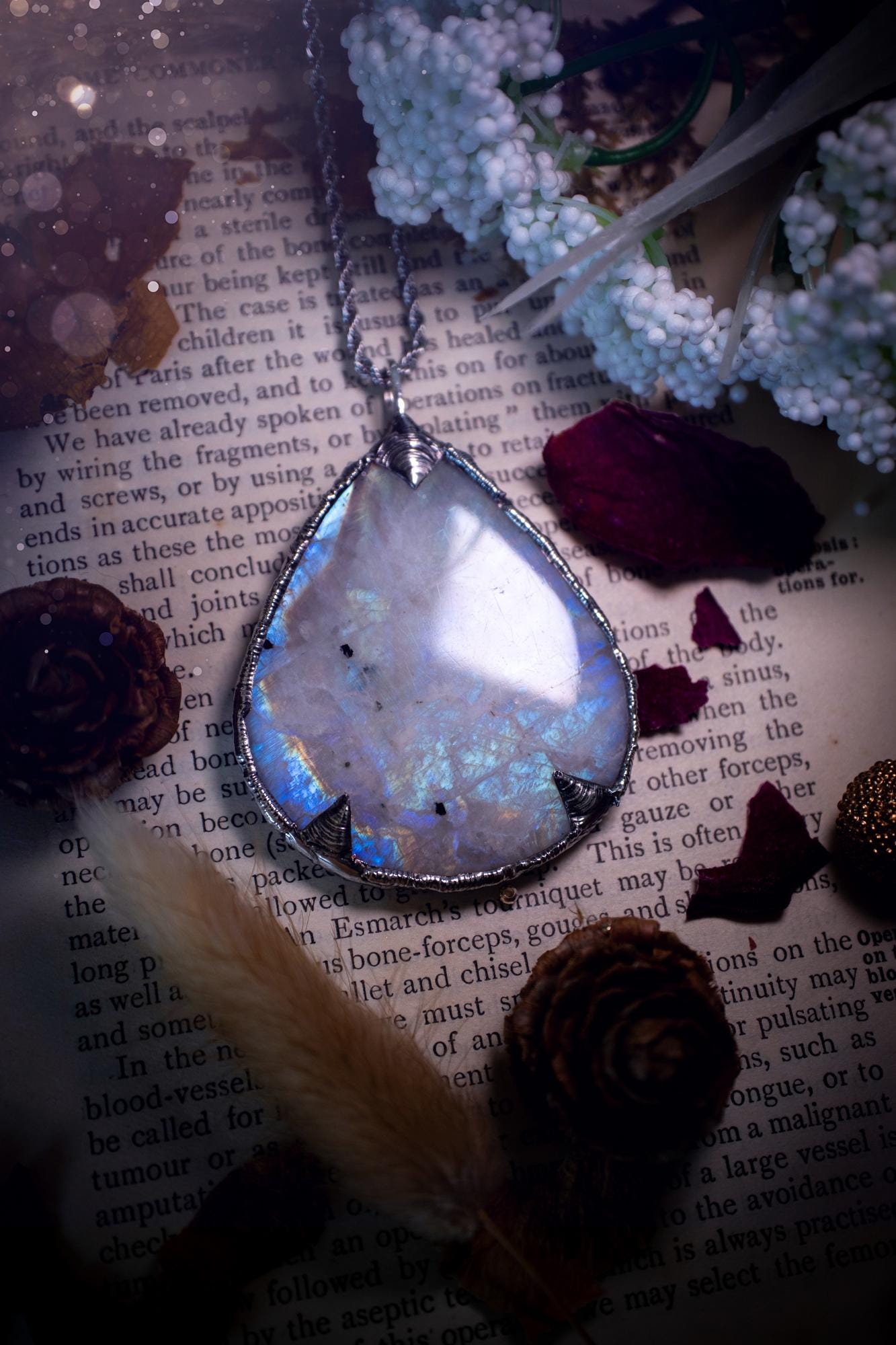 Handmade and beautiful, rainbow moonstone, soft soldered pendant necklace. This pendant necklace features the most gorgeous and flashy rainbow moonstone crystal, full of glittery shimmer and a deep lovely blue hue. Handcrafted using the soft solder method, also known as the tiffany technique, an ancient technique used to created stained glass windows. The solder used is lead free and totally safe to wear, it contains elements of silver and polishes up to a high lustre. Gothic jewellery