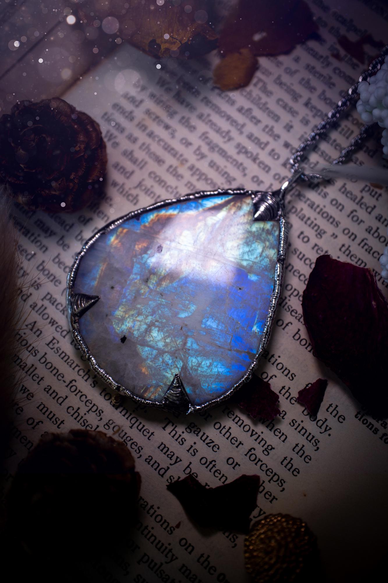 Handmade and beautiful, rainbow moonstone, soft soldered pendant necklace. This pendant necklace features the most gorgeous and flashy rainbow moonstone crystal, full of glittery shimmer and a deep lovely blue hue. Handcrafted using the soft solder method, also known as the tiffany technique, an ancient technique used to created stained glass windows. The solder used is lead free and totally safe to wear, it contains elements of silver and polishes up to a high lustre. Gothic jewellery