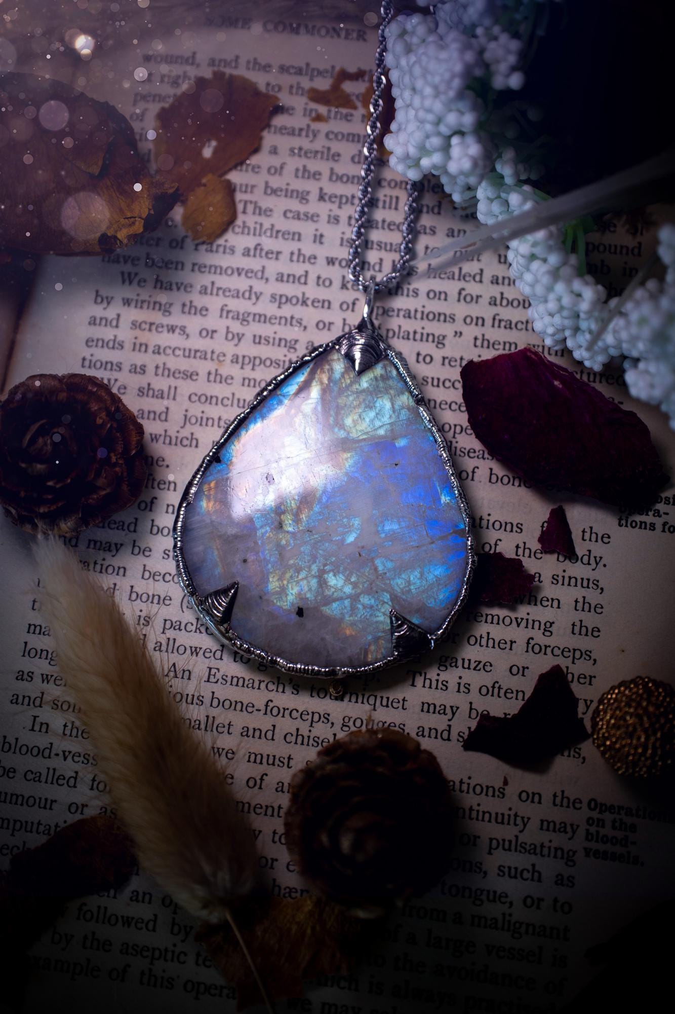 Handmade and beautiful, rainbow moonstone, soft soldered pendant necklace. This pendant necklace features the most gorgeous and flashy rainbow moonstone crystal, full of glittery shimmer and a deep lovely blue hue. Handcrafted using the soft solder method, also known as the tiffany technique, an ancient technique used to created stained glass windows. The solder used is lead free and totally safe to wear, it contains elements of silver and polishes up to a high lustre. Gothic jewellery