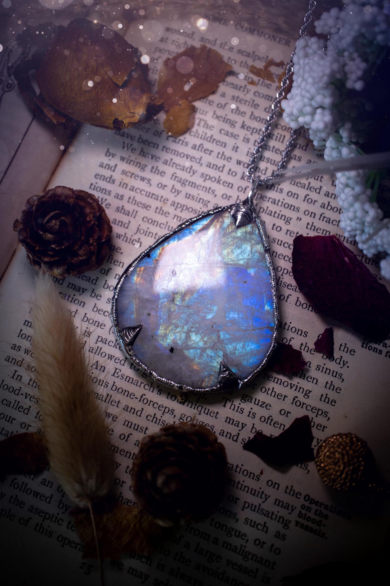 Handmade and beautiful, rainbow moonstone, soft soldered pendant necklace. This pendant necklace features the most gorgeous and flashy rainbow moonstone crystal, full of glittery shimmer and a deep lovely blue hue. Handcrafted using the soft solder method, also known as the tiffany technique, an ancient technique used to created stained glass windows. The solder used is lead free and totally safe to wear, it contains elements of silver and polishes up to a high lustre. Gothic jewellery