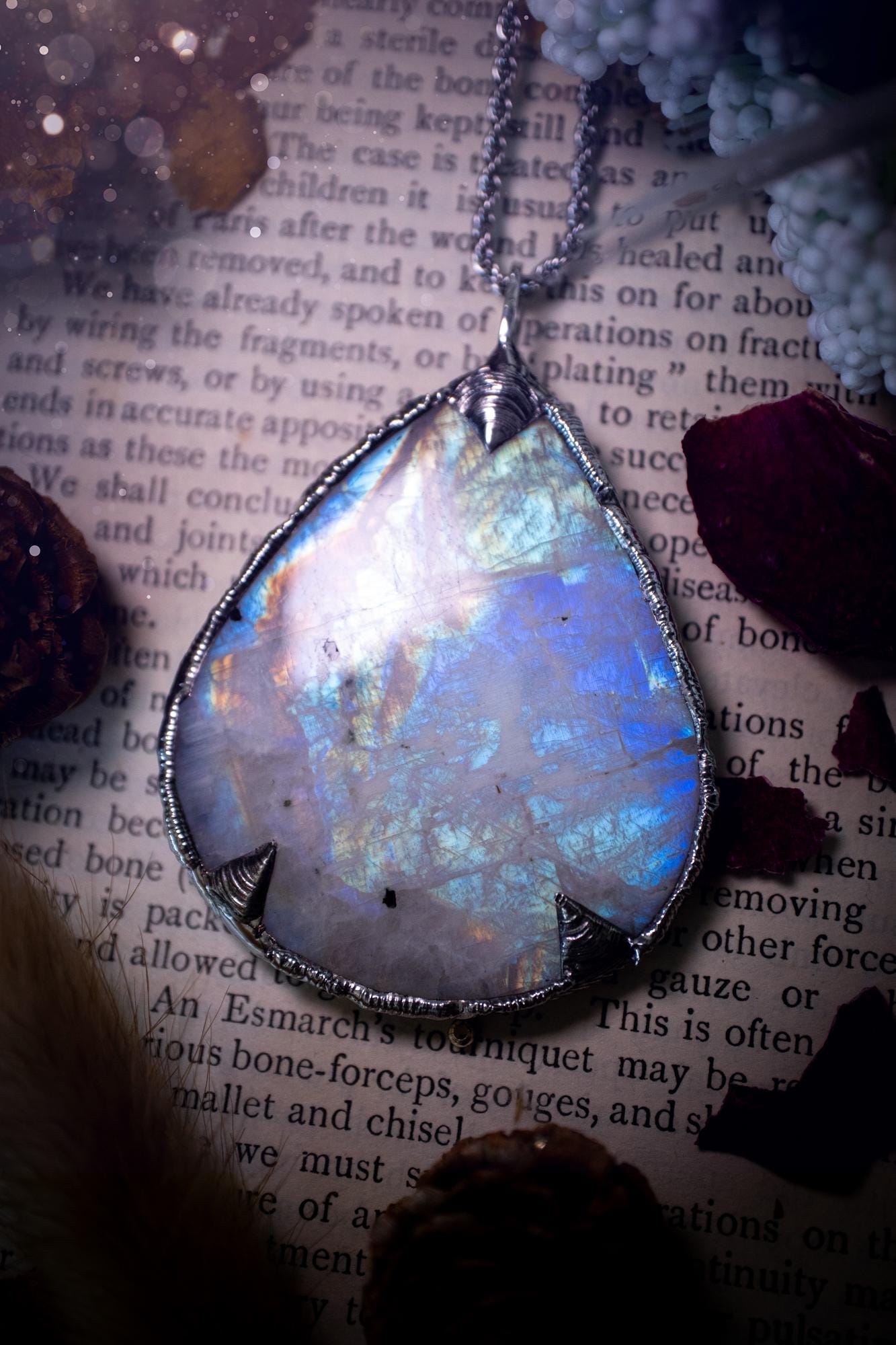 Handmade and beautiful, rainbow moonstone, soft soldered pendant necklace. This pendant necklace features the most gorgeous and flashy rainbow moonstone crystal, full of glittery shimmer and a deep lovely blue hue. Handcrafted using the soft solder method, also known as the tiffany technique, an ancient technique used to created stained glass windows. The solder used is lead free and totally safe to wear, it contains elements of silver and polishes up to a high lustre. Gothic jewellery