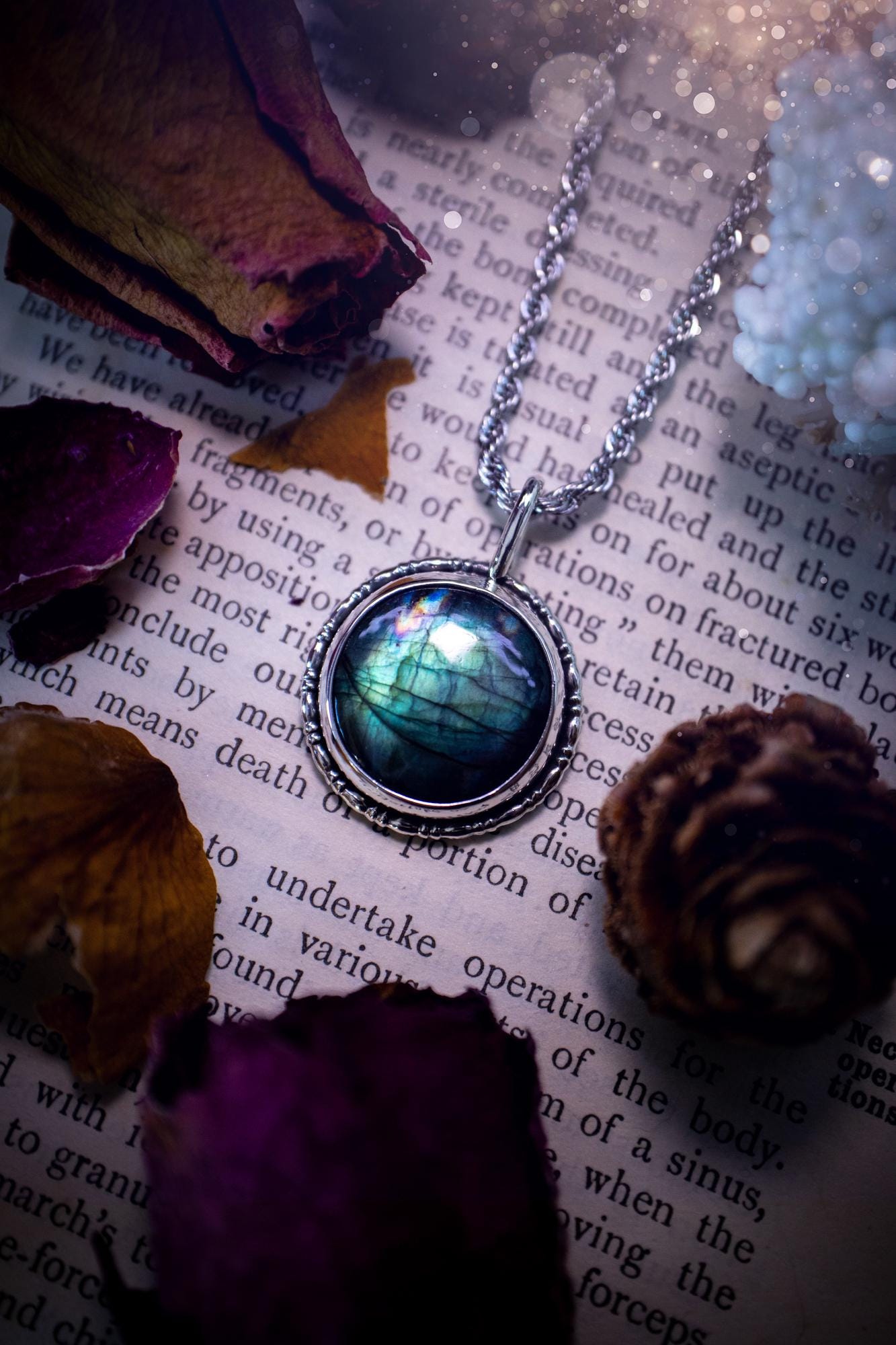 Beautiful and handmade, teal green with a little rainbow, sterling silver pendant necklace. This necklace features a beautiful, forest teal green Labradorite crystal that is completely natural. The pendant itself has been handcrafted using a mix of 999 fine and sterling silver with gallery wire around the bezel to give it a unique feel. A one of a kind piece of jewellery that would complete any crystal or jewellery lovers collection. Witchy and gothic vibes, jewellery gifts for her.