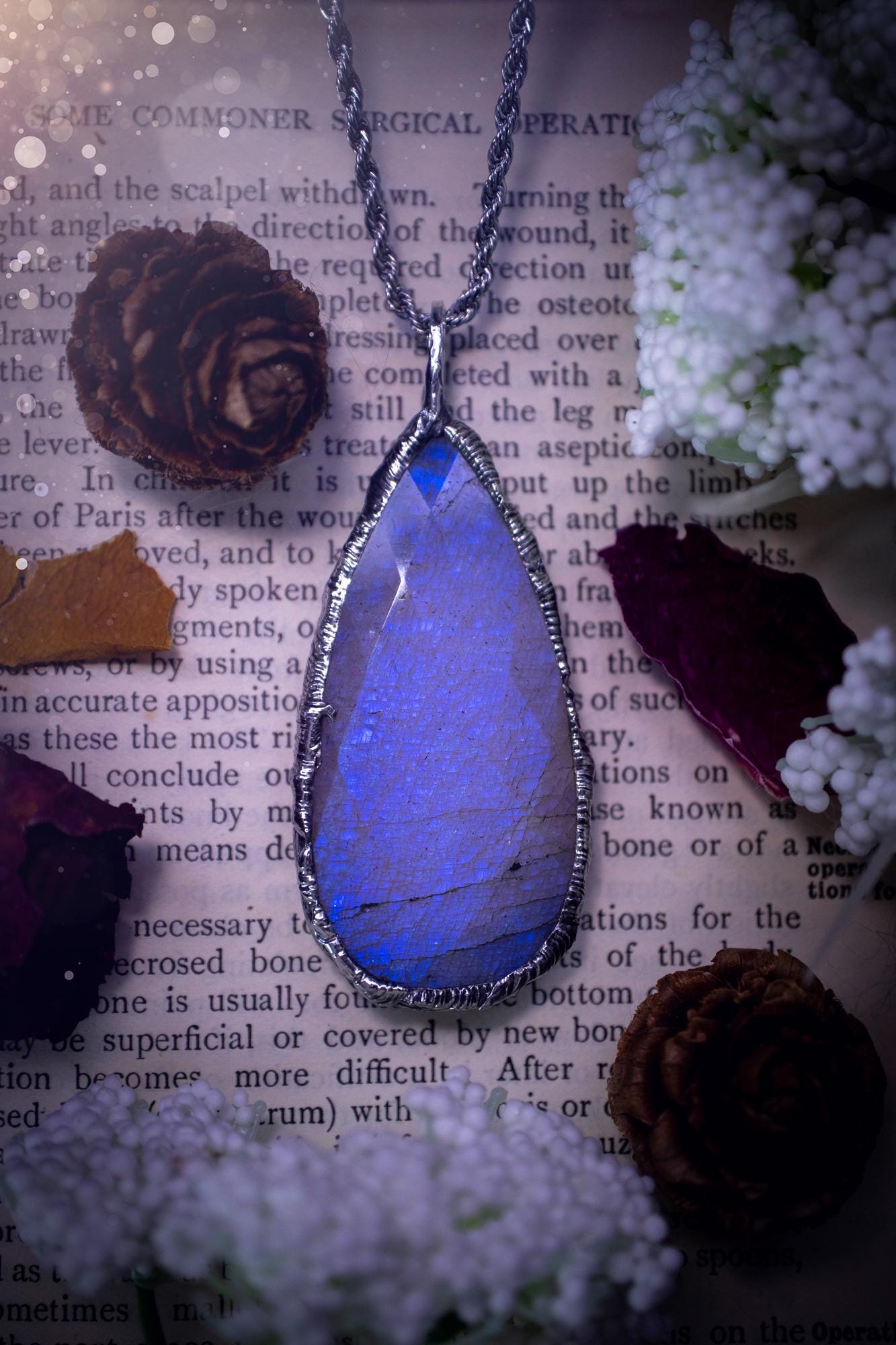 Handmade and beautiful, rose cut, belomorite, soft soldered pendant necklace. This pendant necklace features the most gorgeous and flashy belomorite moonstone crystal, full of glittery shimmer and a deep lovely blue hue. Handcrafted using the soft solder method, also known as the tiffany technique, an ancient technique used to created stained glass windows. The solder used is lead free and totally safe to wear, it contains elements of silver and polishes up to a high lustre. Gothic jewellery