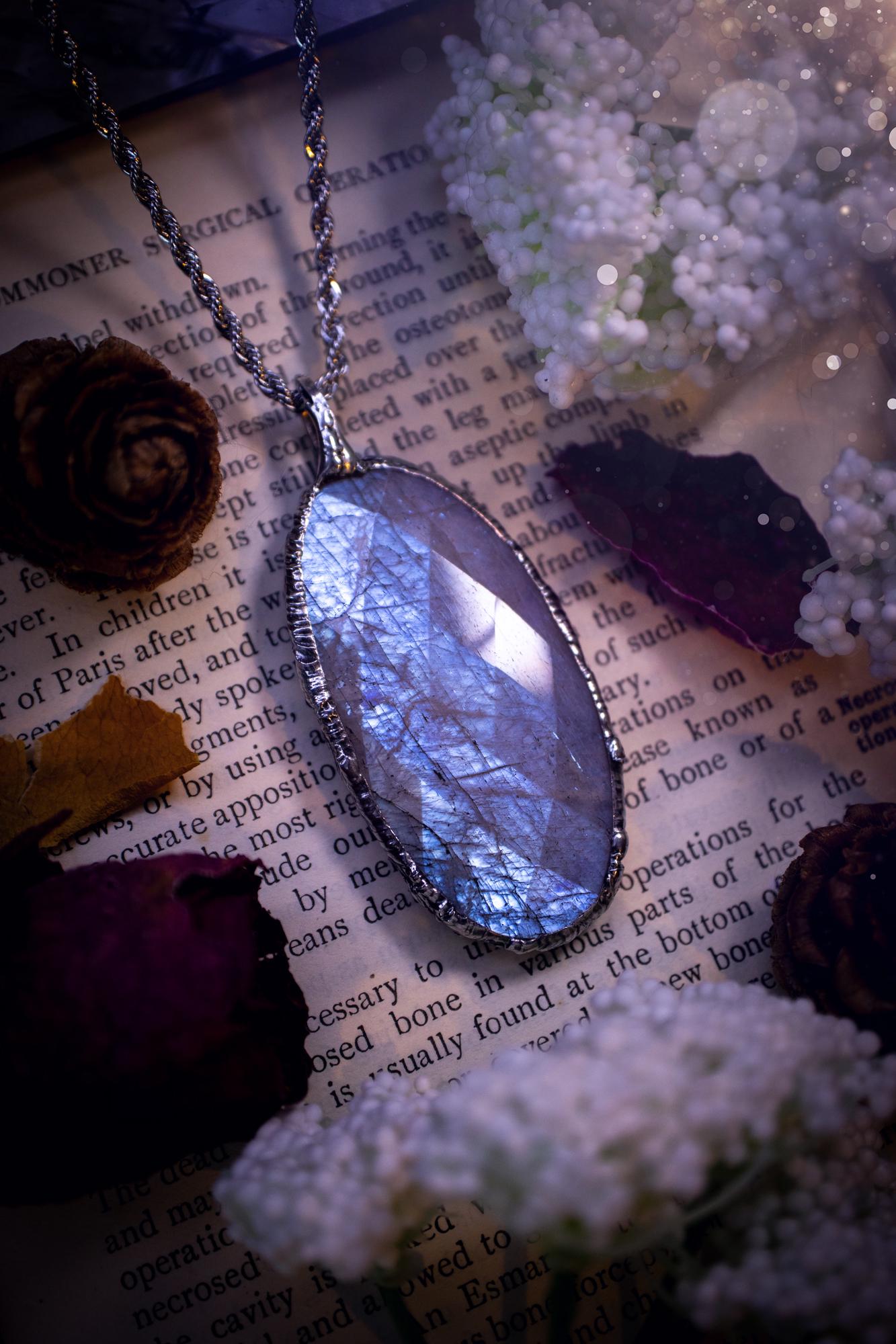 Handmade and beautiful, rose cut, belomorite, soft soldered pendant necklace. This pendant necklace features the most gorgeous and flashy belomorite moonstone crystal, full of glittery shimmer and a deep lovely blue hue. Handcrafted using the soft solder method, also known as the tiffany technique, an ancient technique used to created stained glass windows. The solder used is lead free and totally safe to wear, it contains elements of silver and polishes up to a high lustre. Gothic jewellery