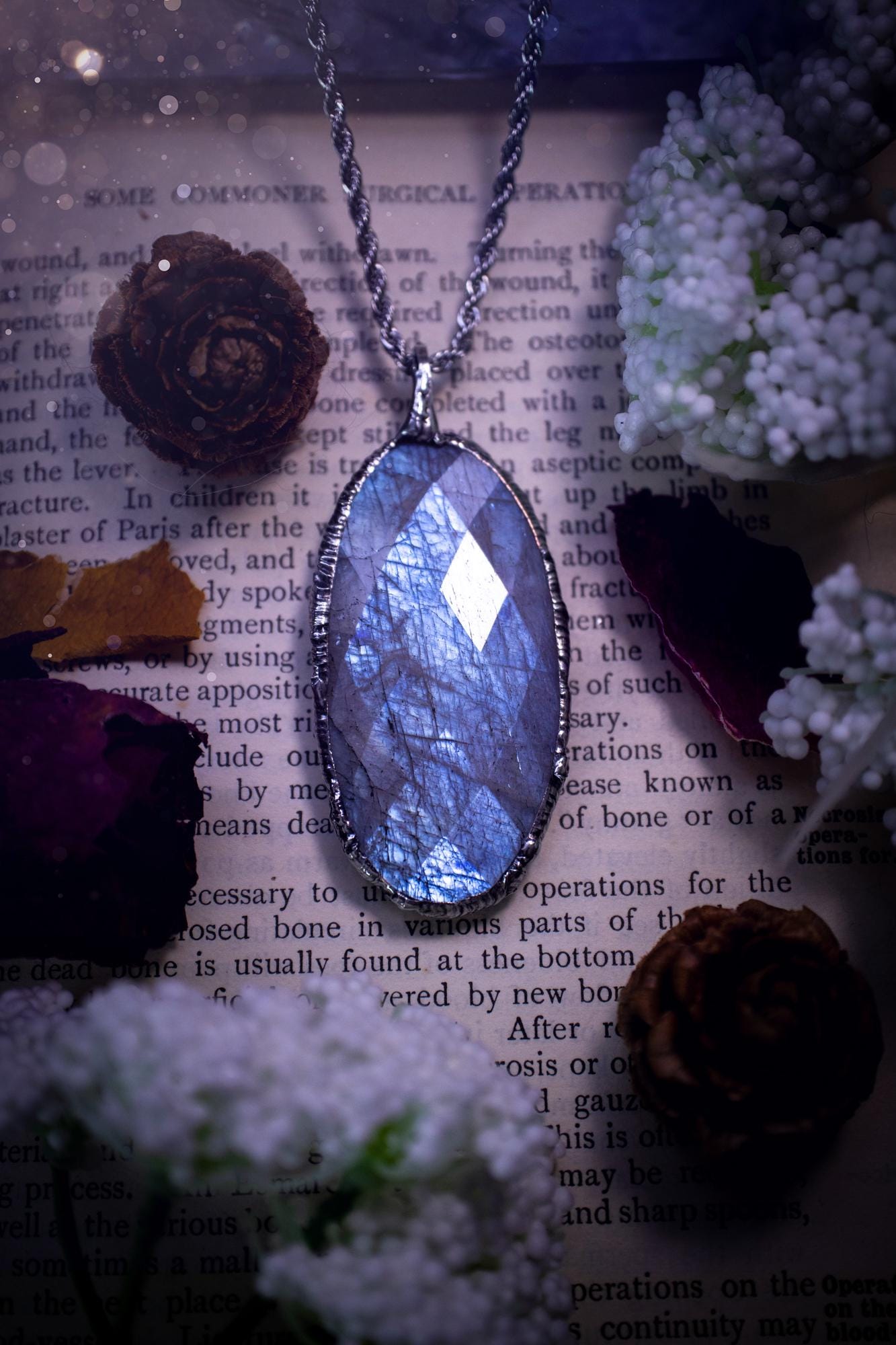 Handmade and beautiful, rose cut, belomorite, soft soldered pendant necklace. This pendant necklace features the most gorgeous and flashy belomorite moonstone crystal, full of glittery shimmer and a deep lovely blue hue. Handcrafted using the soft solder method, also known as the tiffany technique, an ancient technique used to created stained glass windows. The solder used is lead free and totally safe to wear, it contains elements of silver and polishes up to a high lustre. Gothic jewellery