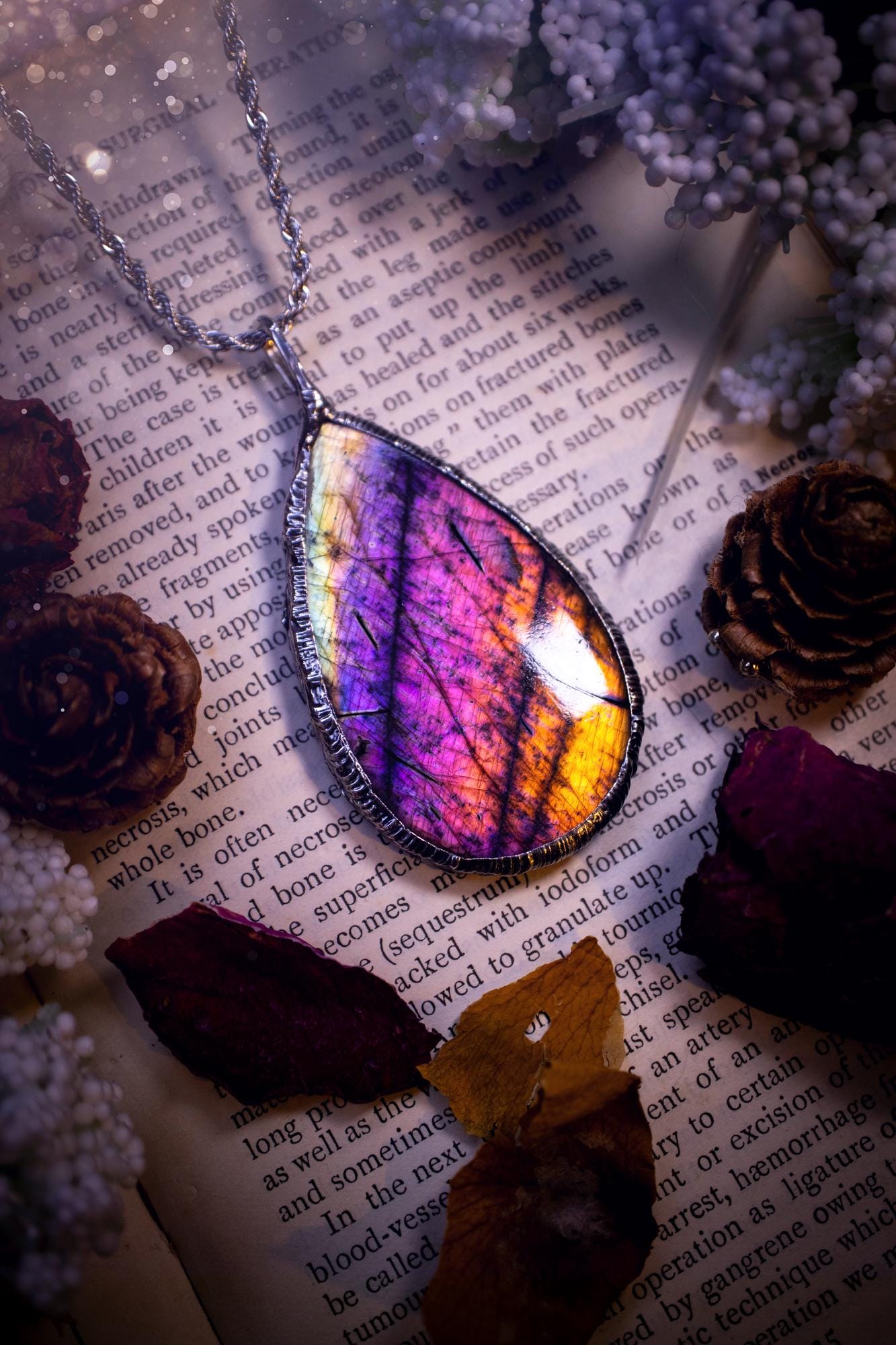 The ultimate labradorite soft soldered pendant necklace. This pendant necklace features the most beautiful and natural Labradorite spectrolite crystal that has so many hues of silver, purple, pink and orange. Handmade using the tiffany technique, also known as soft soldering. This piece is made from solder which contains metals and silver and is safe to wear. The ideal gift for any jewellery lover and crystal collector! Witchy, gothic and hippy jewellery that has been made for the soul.