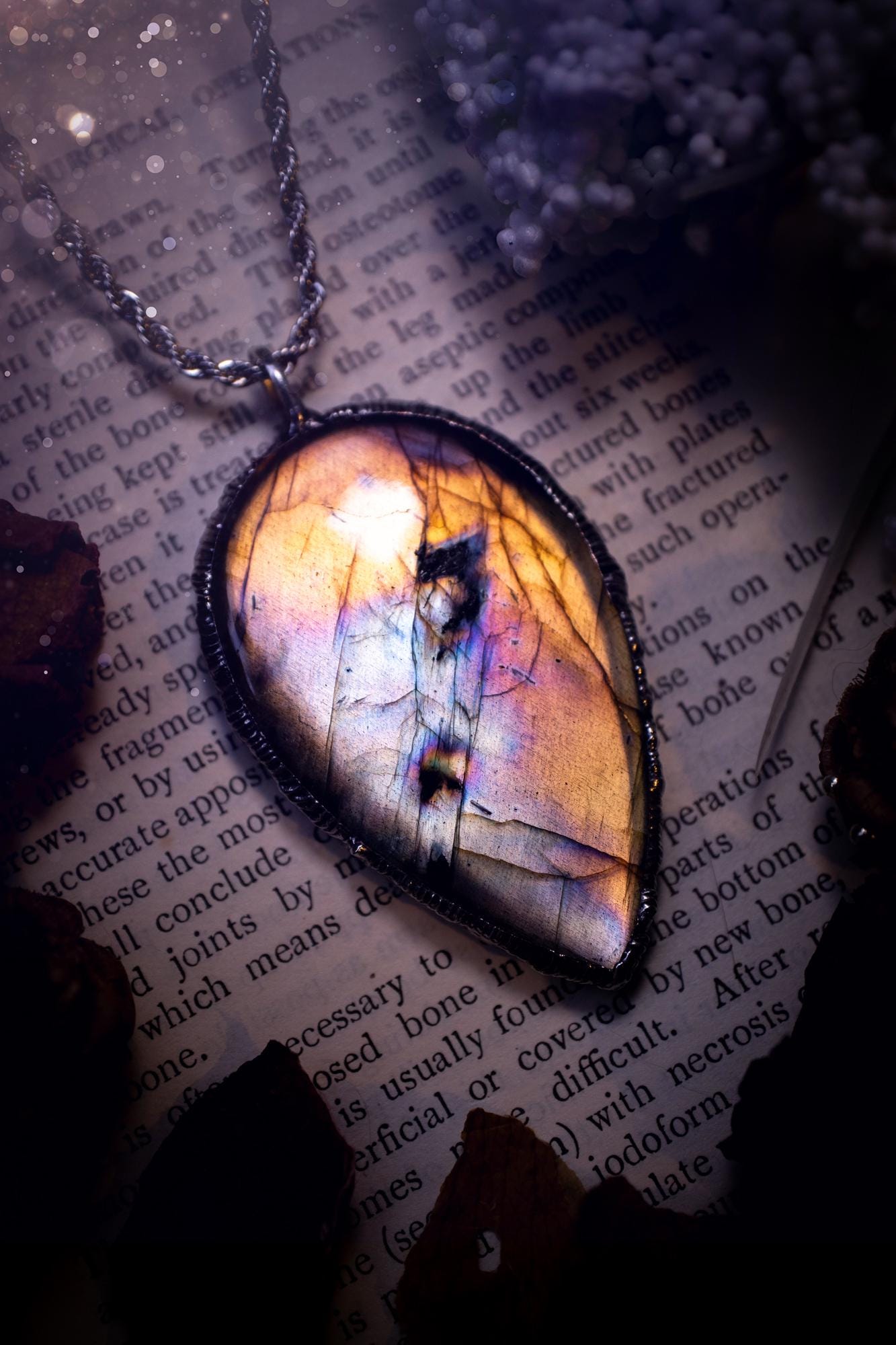 The ultimate labradorite soft soldered pendant necklace. This pendant necklace features the most beautiful, natural and very unique Labradorite spectrolite crystal that has so many hues of silver, purple, pink and orange. Handmade using the tiffany technique, also known as soft soldering. This piece is made from solder which contains silver and is safe to wear. The ideal gift for any jewellery lover and crystal collector! Witchy, gothic and hippy jewellery that has been made for the soul.