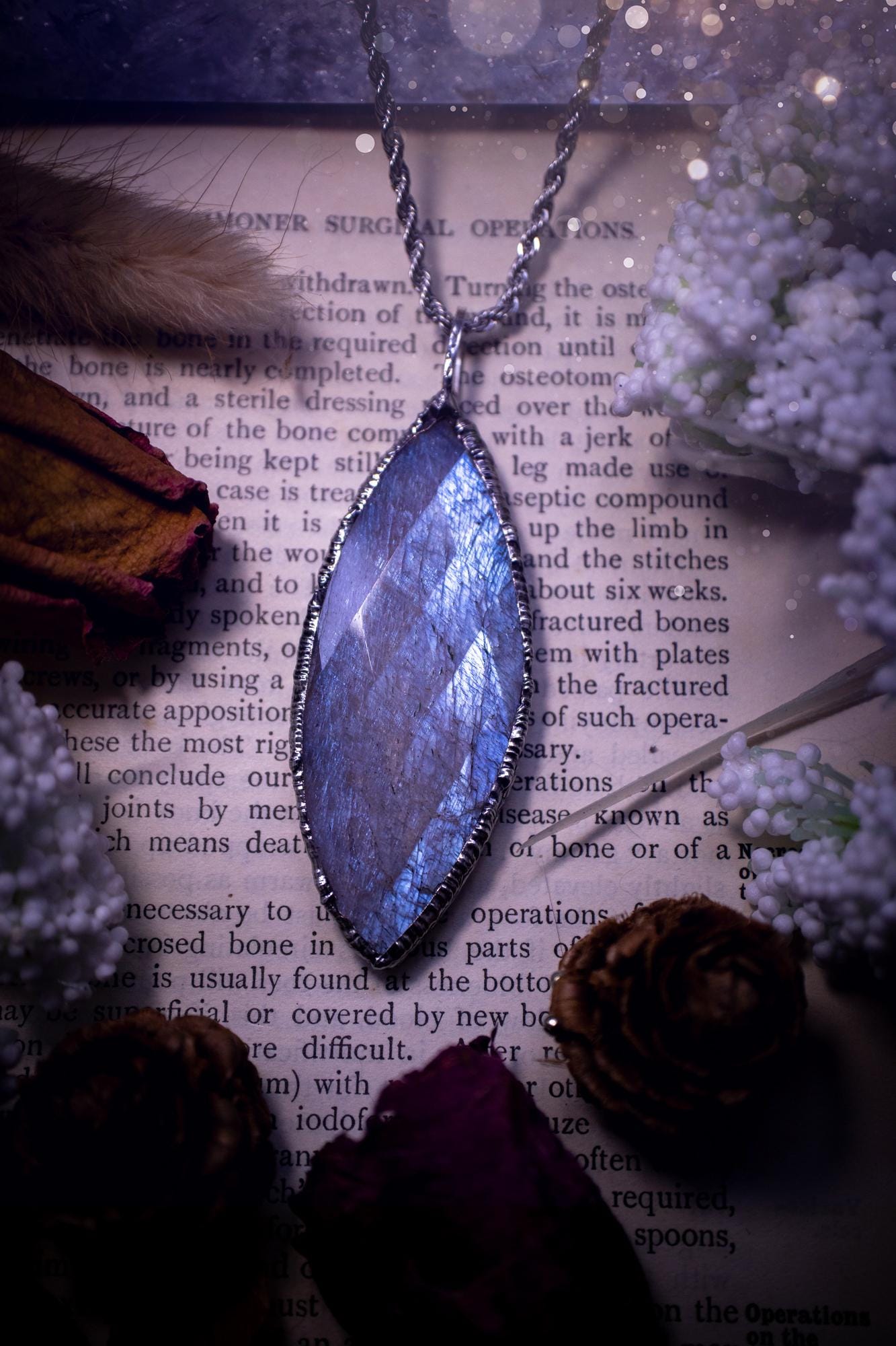Handmade and beautiful, rose cut, belomorite, soft soldered pendant necklace. This pendant necklace features the most gorgeous and flashy belomorite moonstone crystal, full of glittery shimmer and a deep lovely blue hue. Handcrafted using the soft solder method, also known as the tiffany technique, an ancient technique used to created stained glass windows. The solder used is lead free and totally safe to wear, it contains elements of silver and polishes up to a high lustre. Gothic jewellery
