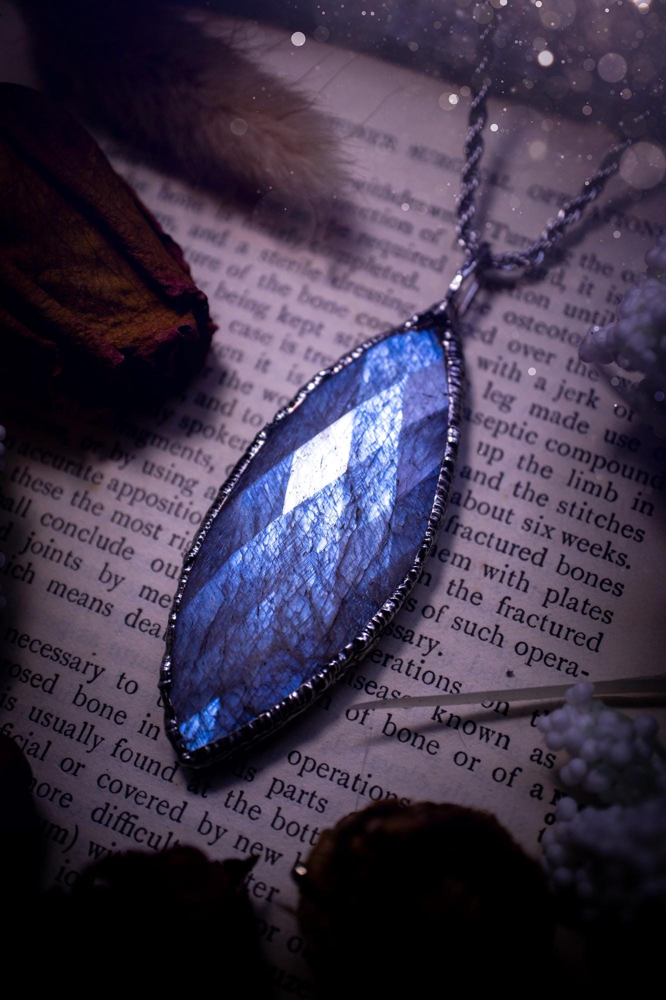 Handmade and beautiful, rose cut, belomorite, soft soldered pendant necklace. This pendant necklace features the most gorgeous and flashy belomorite moonstone crystal, full of glittery shimmer and a deep lovely blue hue. Handcrafted using the soft solder method, also known as the tiffany technique, an ancient technique used to created stained glass windows. The solder used is lead free and totally safe to wear, it contains elements of silver and polishes up to a high lustre. Gothic jewellery