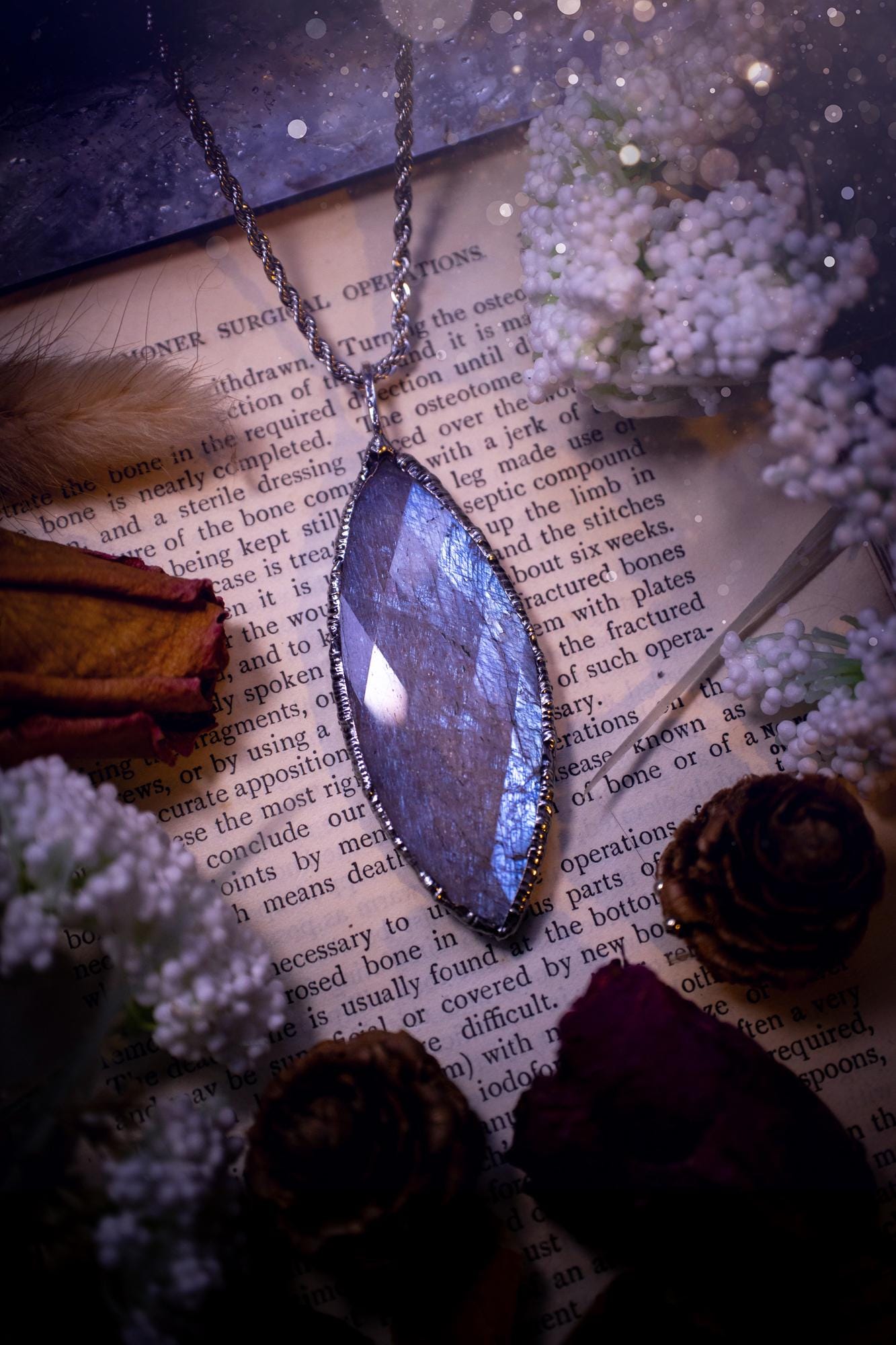 Handmade and beautiful, rose cut, belomorite, soft soldered pendant necklace. This pendant necklace features the most gorgeous and flashy belomorite moonstone crystal, full of glittery shimmer and a deep lovely blue hue. Handcrafted using the soft solder method, also known as the tiffany technique, an ancient technique used to created stained glass windows. The solder used is lead free and totally safe to wear, it contains elements of silver and polishes up to a high lustre. Gothic jewellery