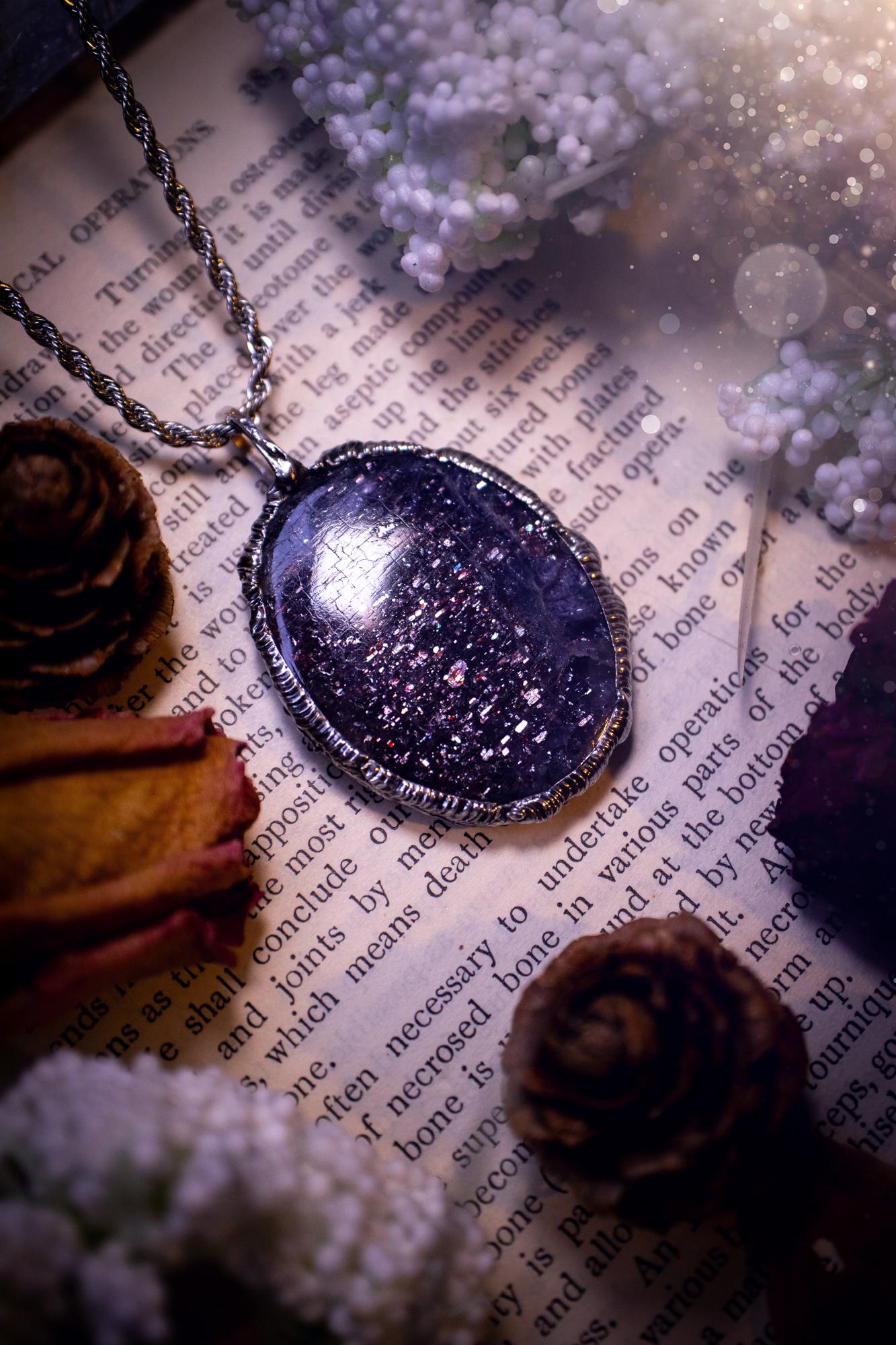 Beautiful and very unique, iolite sunstone crystal, soft soldered pendant necklace. This pendant feature the most sparkly iolite sunstone crystal and is full of purple hues with shimmer! Handmade using the tiffany technique, also known as soft soldering. This piece is made from solder which contains metals and silver and is safe to wear. The ideal gift for any jewellery lover and crystal collector! Witchy, gothic and hippy jewellery that has been made for the soul.