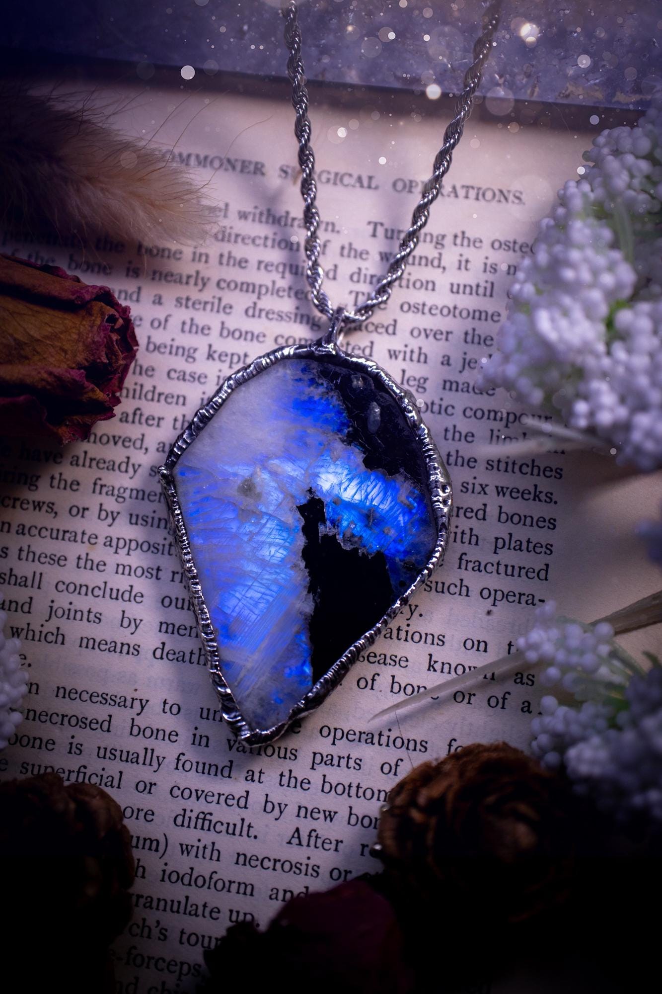 Handmade and beautiful, rainbow moonstone slab, soft soldered pendant necklace. This pendant necklace features the most gorgeous and flashy rainbow moonstone slab crystal, full of glittery shimmer and a deep lovely blue hue. Handcrafted using the soft solder method, also known as the tiffany technique, an ancient technique used to created stained glass windows. The solder used is lead free and totally safe to wear, it contains elements of silver and polishes up to a high lustre. Gothic jewellery