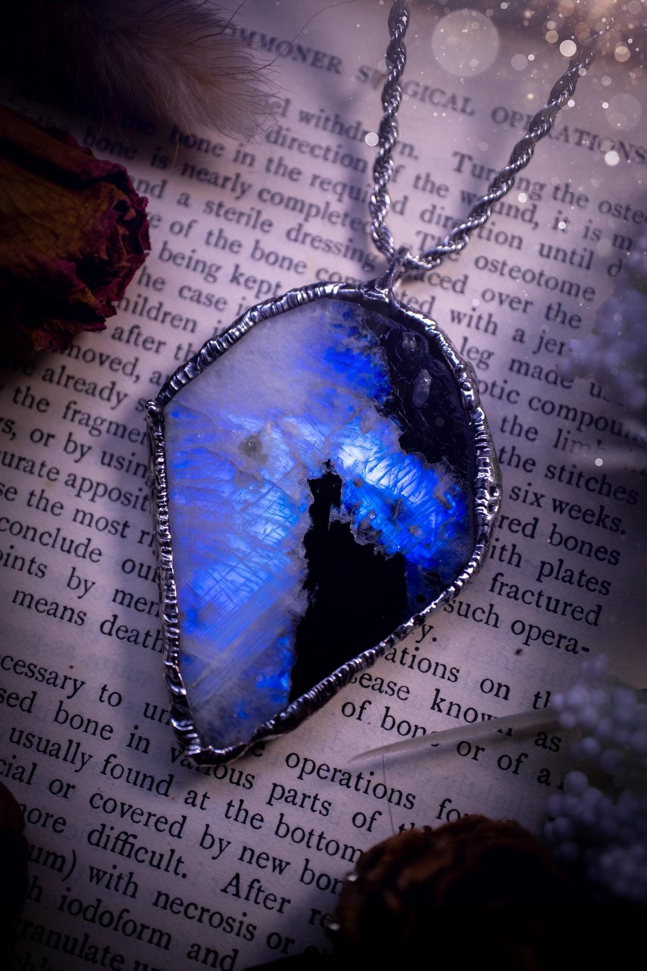 Handmade and beautiful, rainbow moonstone slab, soft soldered pendant necklace. This pendant necklace features the most gorgeous and flashy rainbow moonstone slab crystal, full of glittery shimmer and a deep lovely blue hue. Handcrafted using the soft solder method, also known as the tiffany technique, an ancient technique used to created stained glass windows. The solder used is lead free and totally safe to wear, it contains elements of silver and polishes up to a high lustre. Gothic jewellery