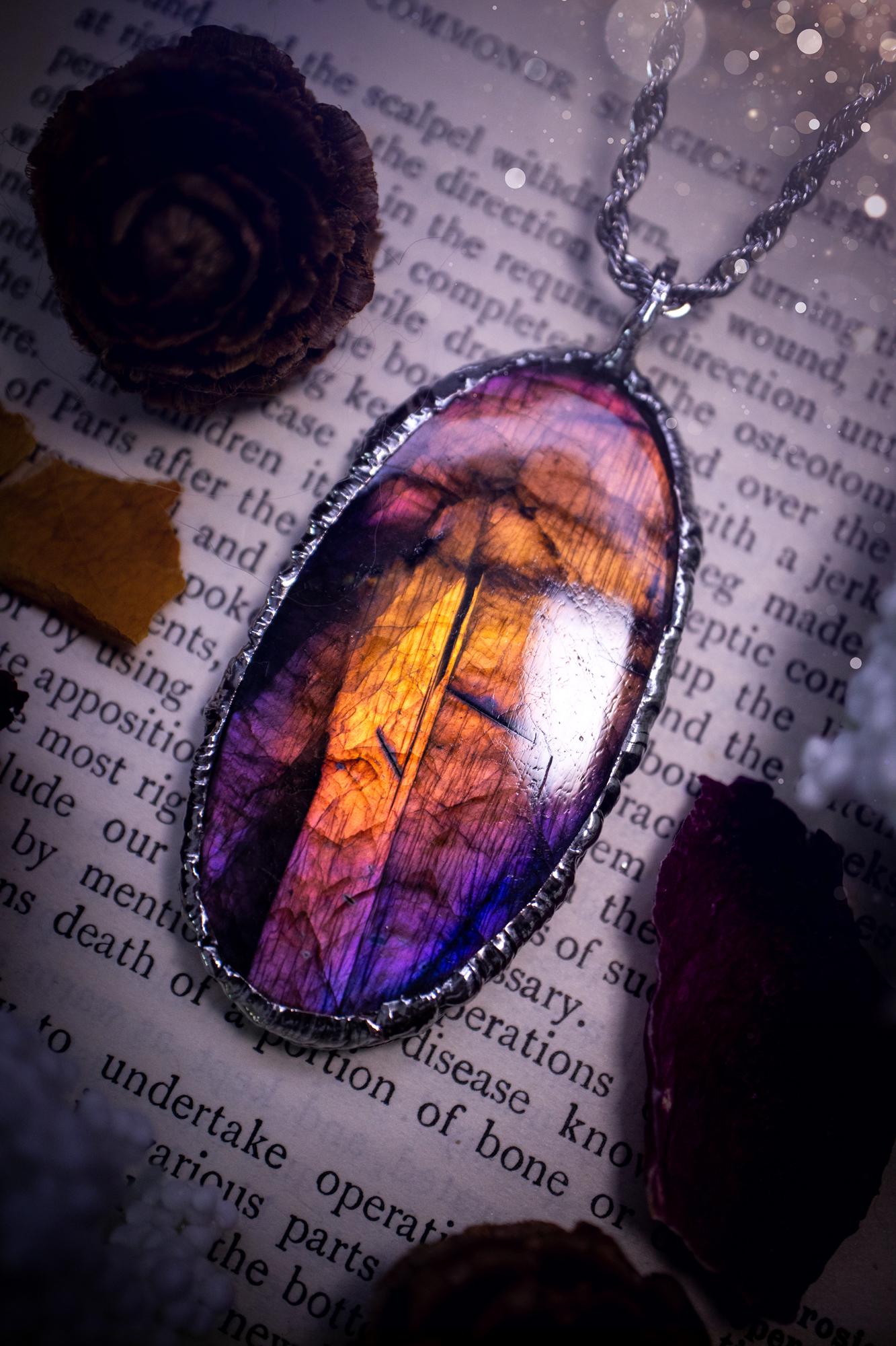 The ultimate labradorite soft soldered pendant necklace. This pendant necklace features the most beautiful and natural Labradorite spectrolite crystal that has so many hues of purple, pink and orange. Handmade using the tiffany technique, also known as soft soldering. This piece is made from solder which contains metals and silver and is safe to wear. The ideal gift for any jewellery lover and crystal collector! Witchy, gothic and hippy jewellery that has been made for the soul.
