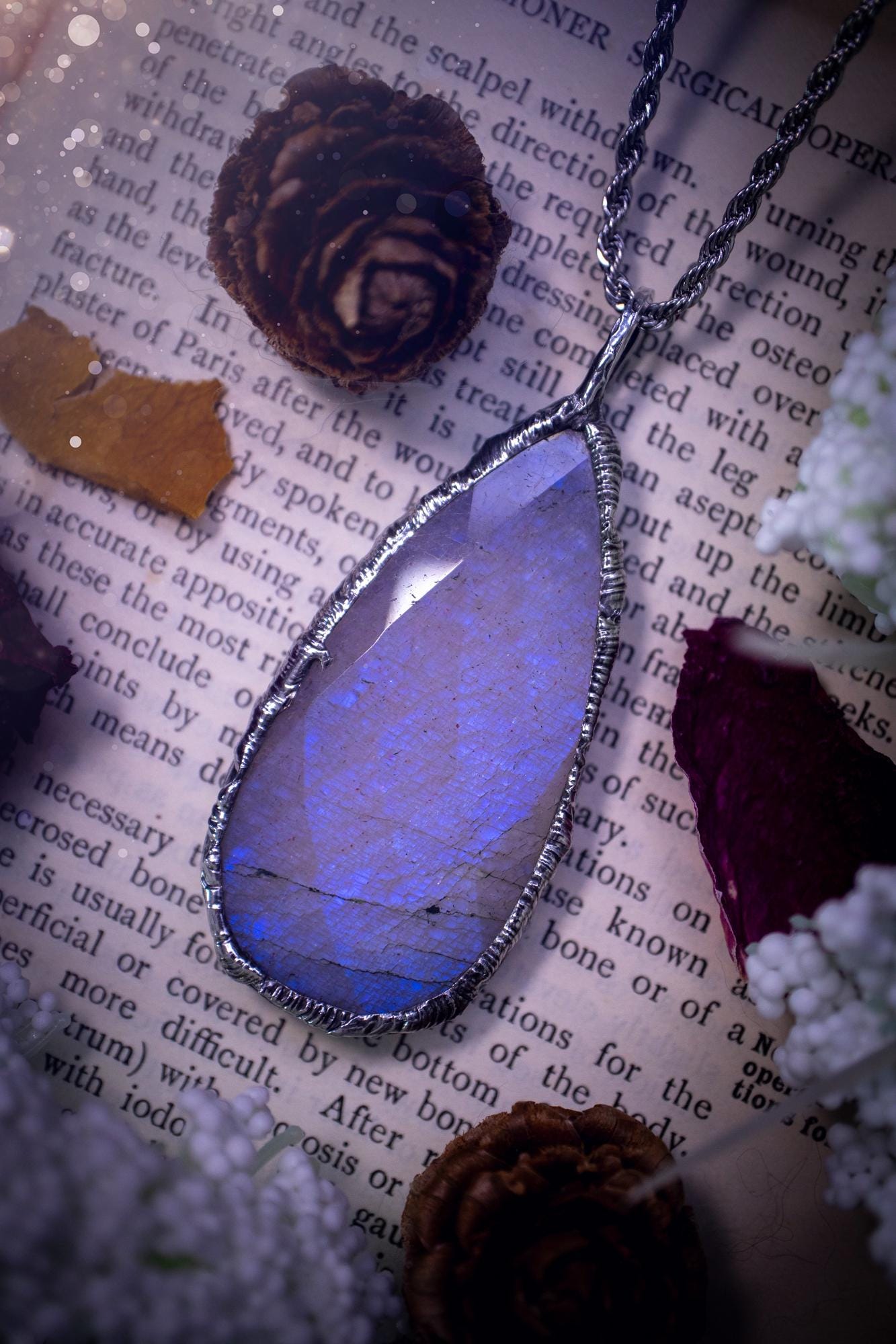 Handmade and beautiful, rose cut, belomorite, soft soldered pendant necklace. This pendant necklace features the most gorgeous and flashy belomorite moonstone crystal, full of glittery shimmer and a deep lovely blue hue. Handcrafted using the soft solder method, also known as the tiffany technique, an ancient technique used to created stained glass windows. The solder used is lead free and totally safe to wear, it contains elements of silver and polishes up to a high lustre. Gothic jewellery