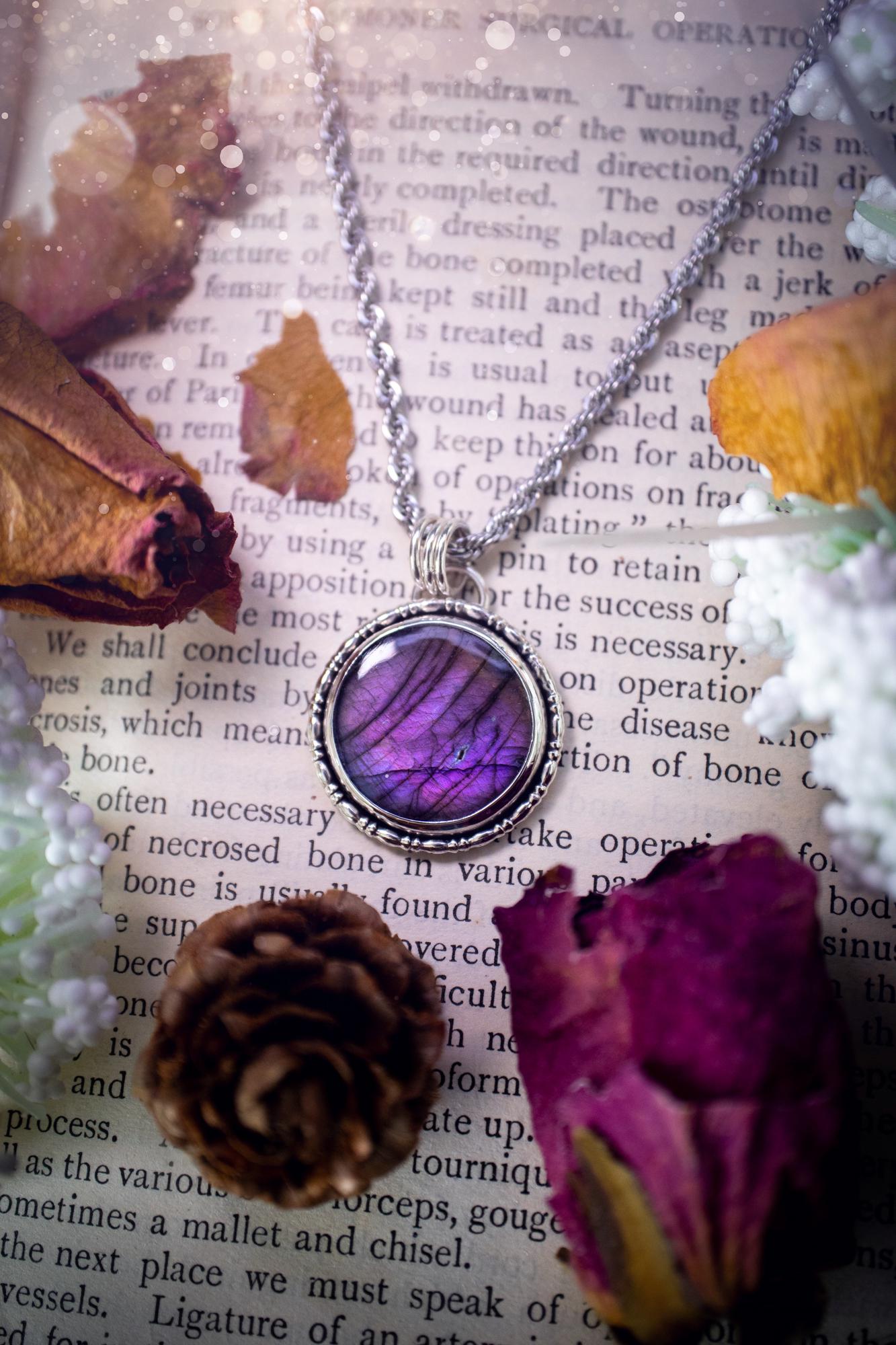 Beautifully handcrafted, deep purple, pink and blue multi-flash labradorite, spectrolite crystal pendant necklace. This stunning crystal pendant has been made using recycled fine and sterling silver. Featuring a stunning and vibrant purple and pink flash labradorite that has the most beautiful stripey patterns within. This crystal pendant would be an ideal gift for any crystal or jewellery lover, which has the a mix of hippy and witch vibes!
