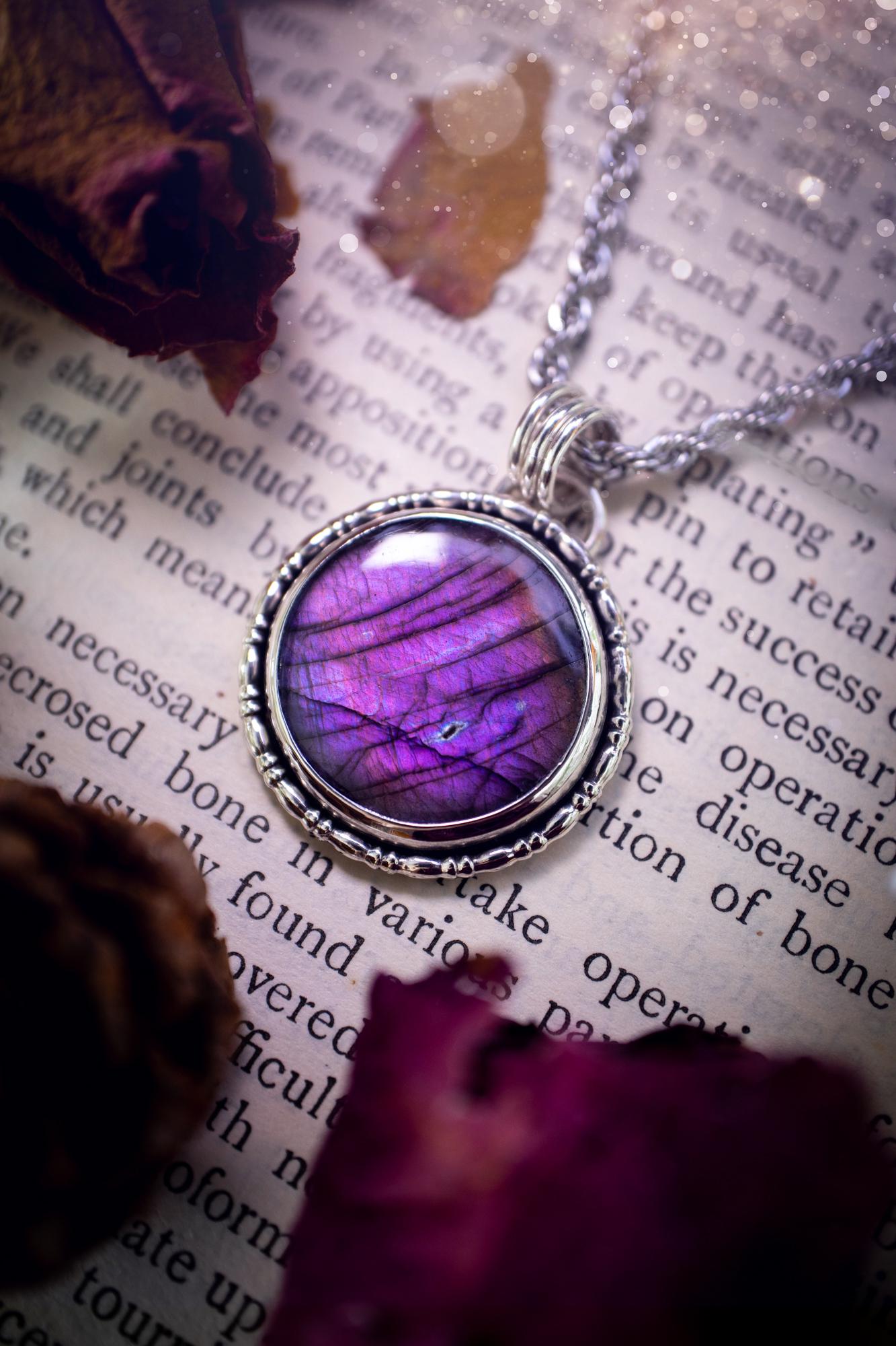Beautifully handcrafted, deep purple, pink and blue multi-flash labradorite, spectrolite crystal pendant necklace. This stunning crystal pendant has been made using recycled fine and sterling silver. Featuring a stunning and vibrant purple and pink flash labradorite that has the most beautiful stripey patterns within. This crystal pendant would be an ideal gift for any crystal or jewellery lover, which has the a mix of hippy and witch vibes!