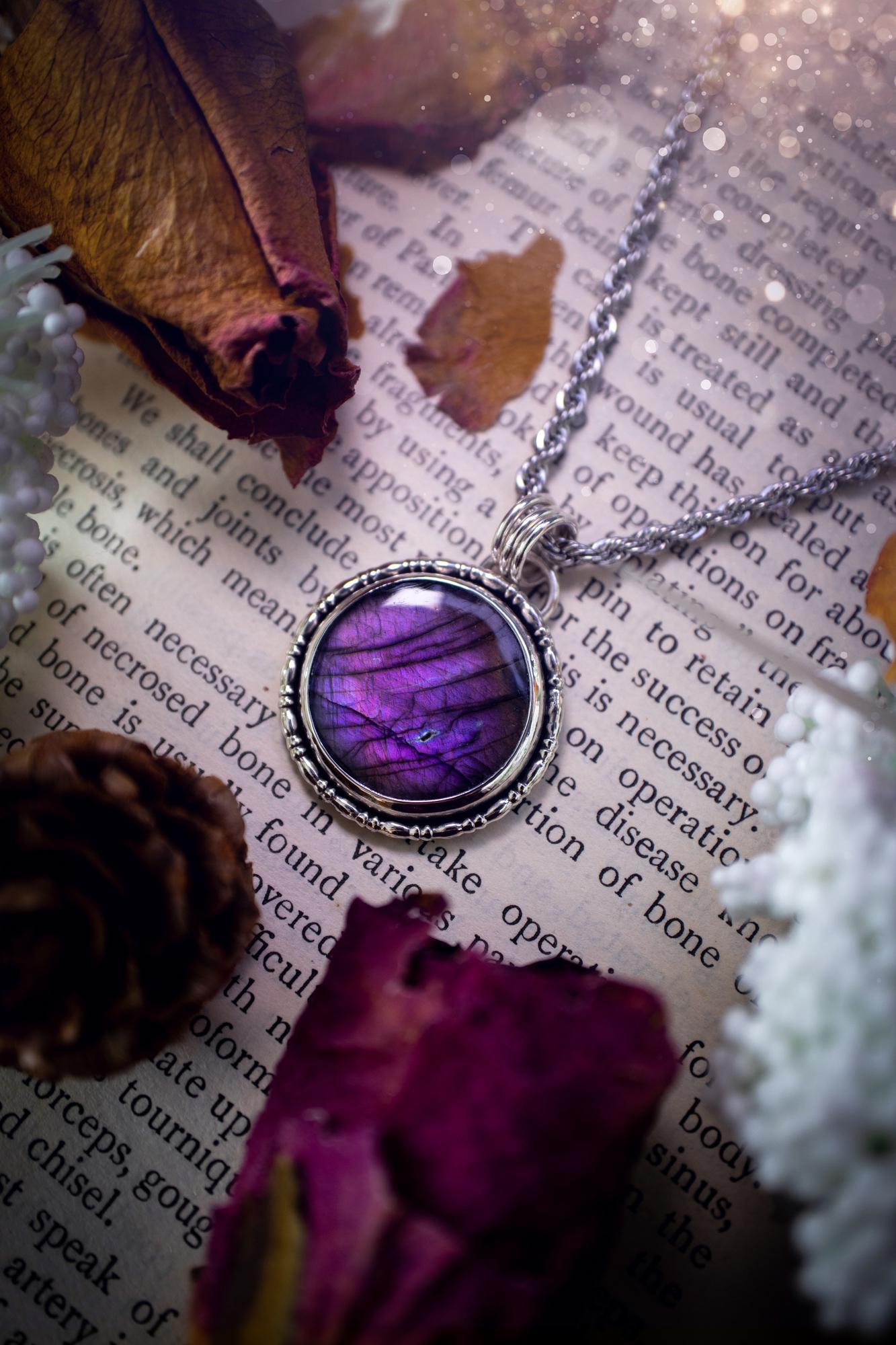 Beautifully handcrafted, deep purple, pink and blue multi-flash labradorite, spectrolite crystal pendant necklace. This stunning crystal pendant has been made using recycled fine and sterling silver. Featuring a stunning and vibrant purple and pink flash labradorite that has the most beautiful stripey patterns within. This crystal pendant would be an ideal gift for any crystal or jewellery lover, which has the a mix of hippy and witch vibes!