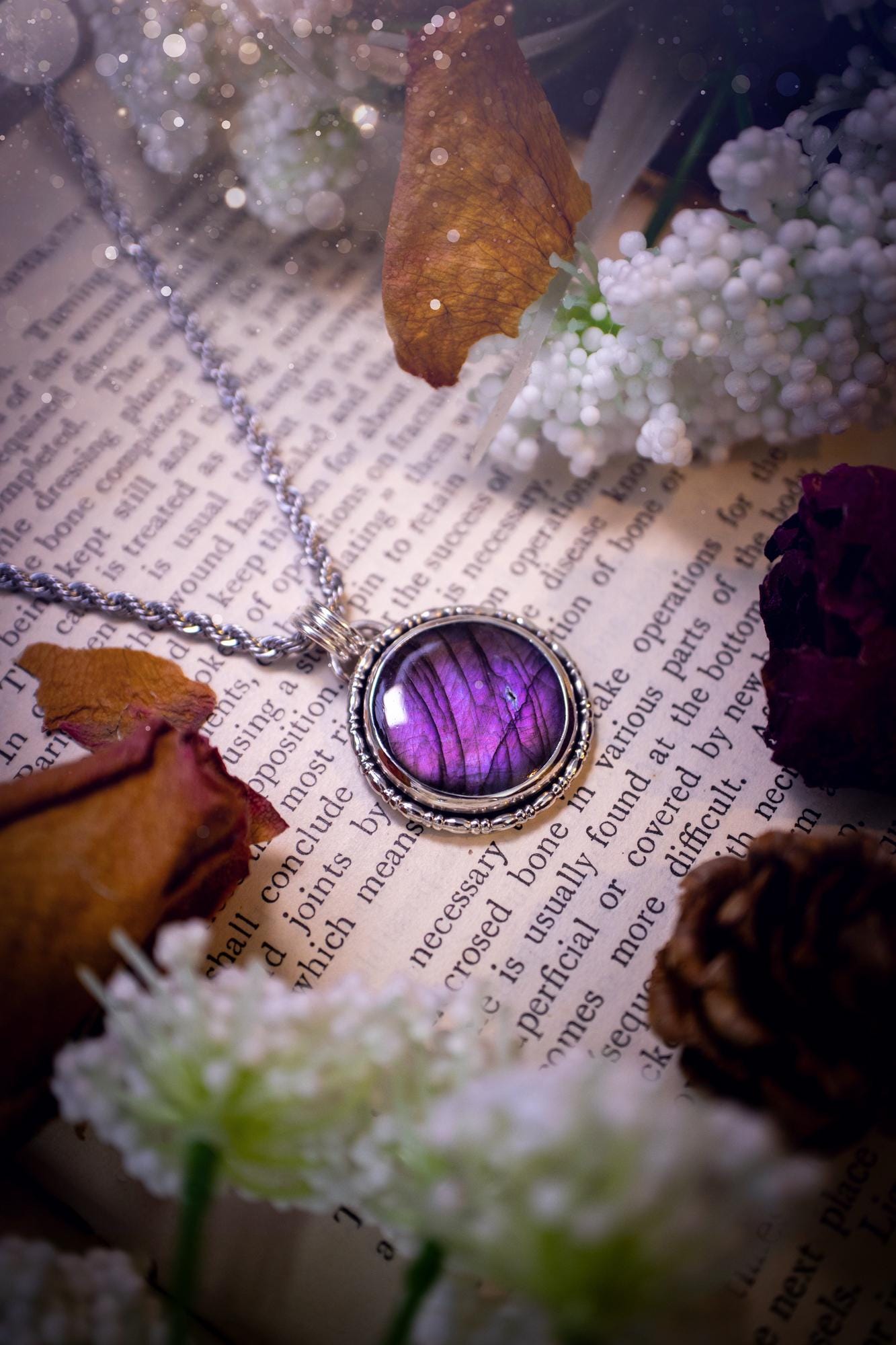 Beautifully handcrafted, deep purple, pink and blue multi-flash labradorite, spectrolite crystal pendant necklace. This stunning crystal pendant has been made using recycled fine and sterling silver. Featuring a stunning and vibrant purple and pink flash labradorite that has the most beautiful stripey patterns within. This crystal pendant would be an ideal gift for any crystal or jewellery lover, which has the a mix of hippy and witch vibes!
