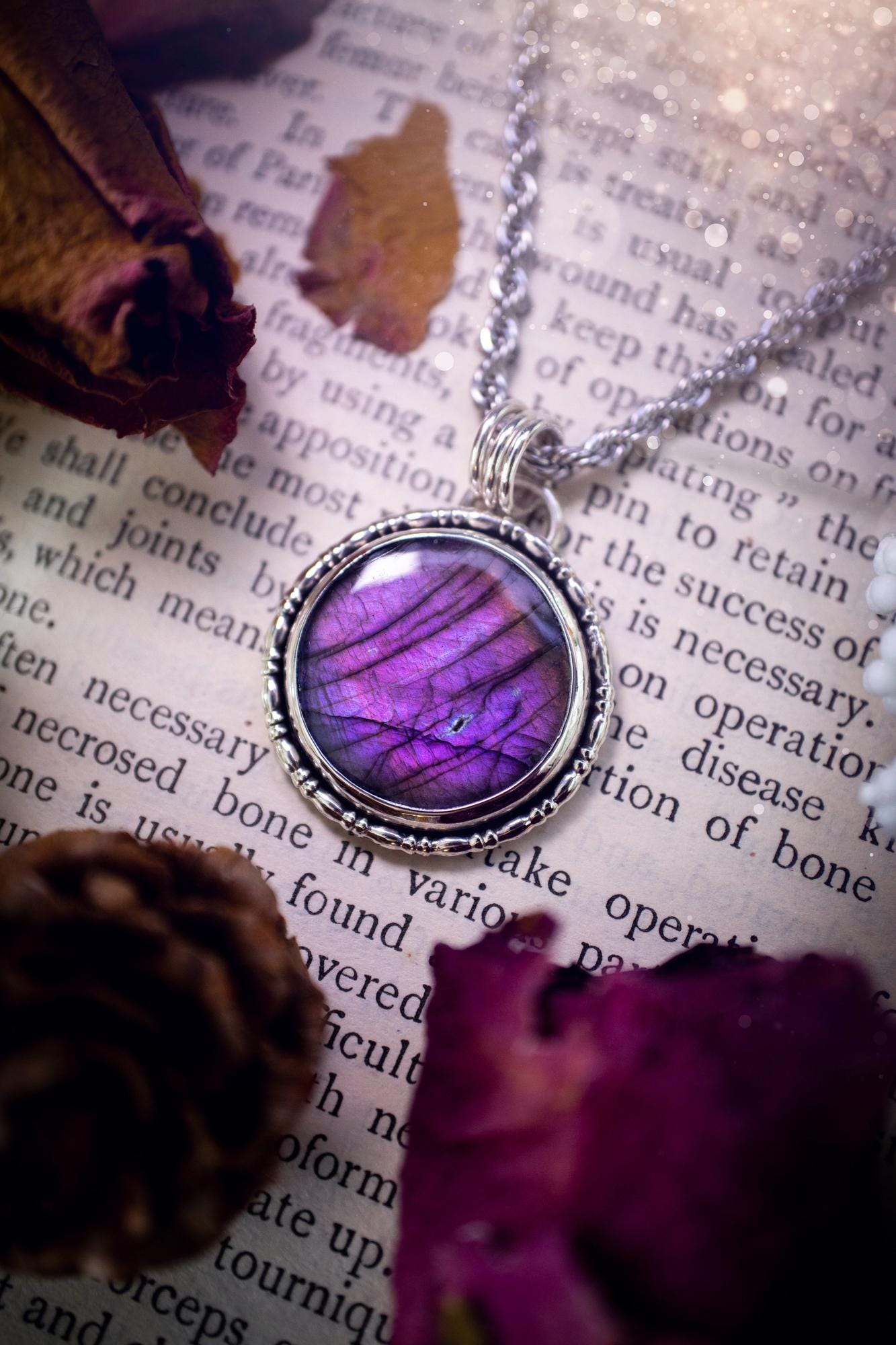 Beautifully handcrafted, deep purple, pink and blue multi-flash labradorite, spectrolite crystal pendant necklace. This stunning crystal pendant has been made using recycled fine and sterling silver. Featuring a stunning and vibrant purple and pink flash labradorite that has the most beautiful stripey patterns within. This crystal pendant would be an ideal gift for any crystal or jewellery lover, which has the a mix of hippy and witch vibes!