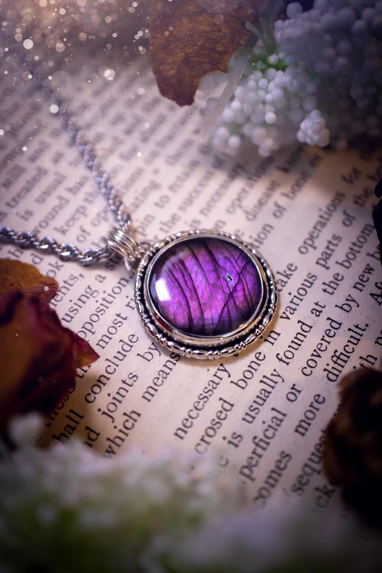 Beautifully handcrafted, deep purple, pink and blue multi-flash labradorite, spectrolite crystal pendant necklace. This stunning crystal pendant has been made using recycled fine and sterling silver. Featuring a stunning and vibrant purple and pink flash labradorite that has the most beautiful stripey patterns within. This crystal pendant would be an ideal gift for any crystal or jewellery lover, which has the a mix of hippy and witch vibes!
