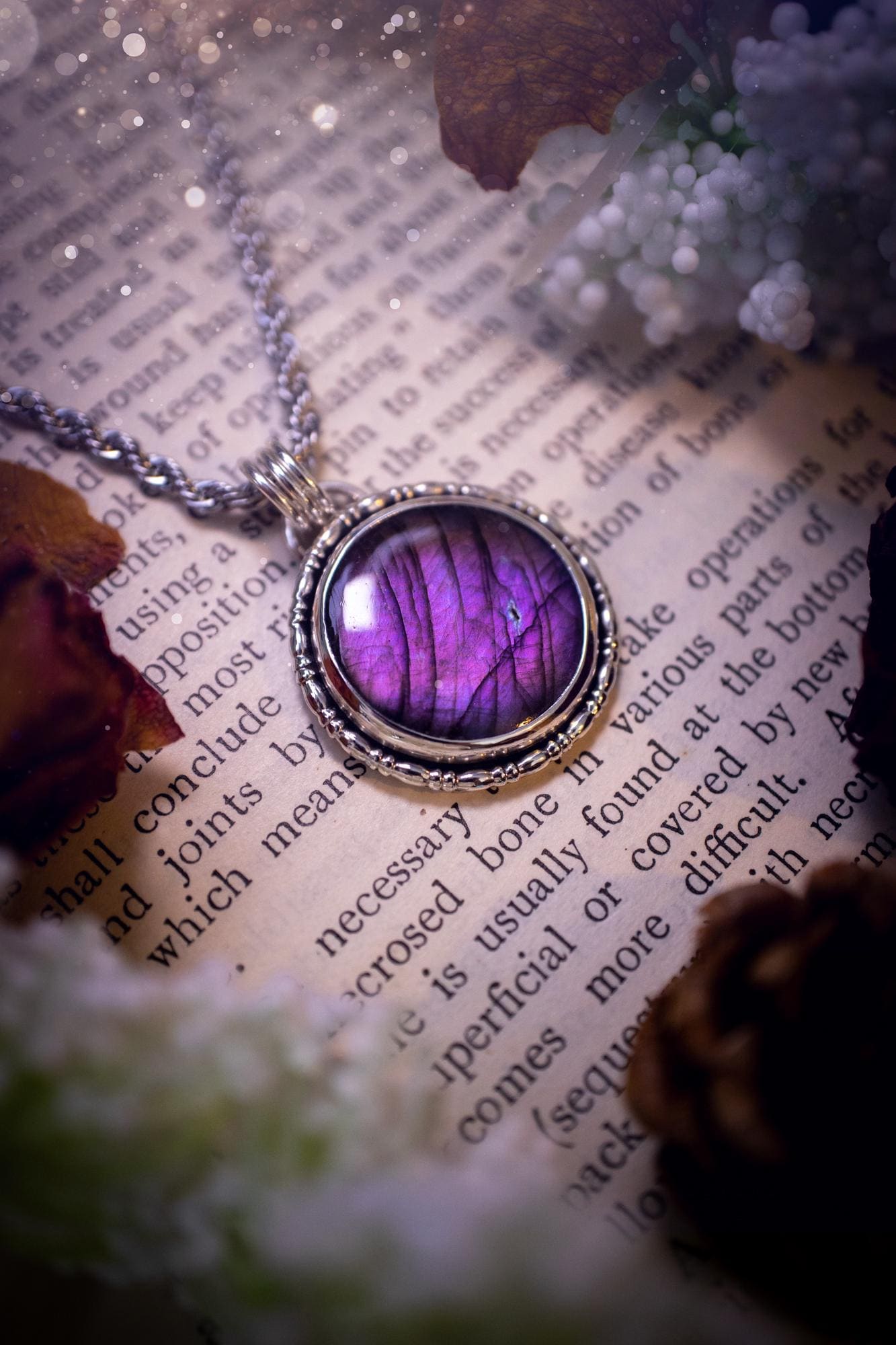 Beautifully handcrafted, deep purple, pink and blue multi-flash labradorite, spectrolite crystal pendant necklace. This stunning crystal pendant has been made using recycled fine and sterling silver. Featuring a stunning and vibrant purple and pink flash labradorite that has the most beautiful stripey patterns within. This crystal pendant would be an ideal gift for any crystal or jewellery lover, which has the a mix of hippy and witch vibes!