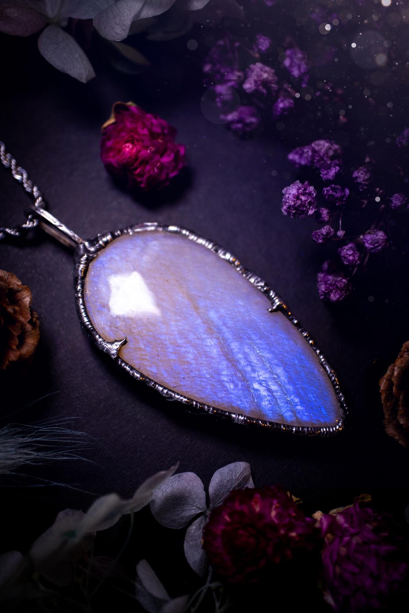 Handmade and beautiful, flashy belomorite, soft soldered pendant necklace. This pendant necklace features the most gorgeous and flashy belomorite moonstone crystal, full of glittery shimmer and a deep lovely blue hue. Handcrafted using the soft solder method, also known as the tiffany technique, an ancient technique used to created stained glass windows. The solder used is lead free and totally safe to wear, it contains elements of silver and polishes up to a high lustre. Gothic witchy jewellery
