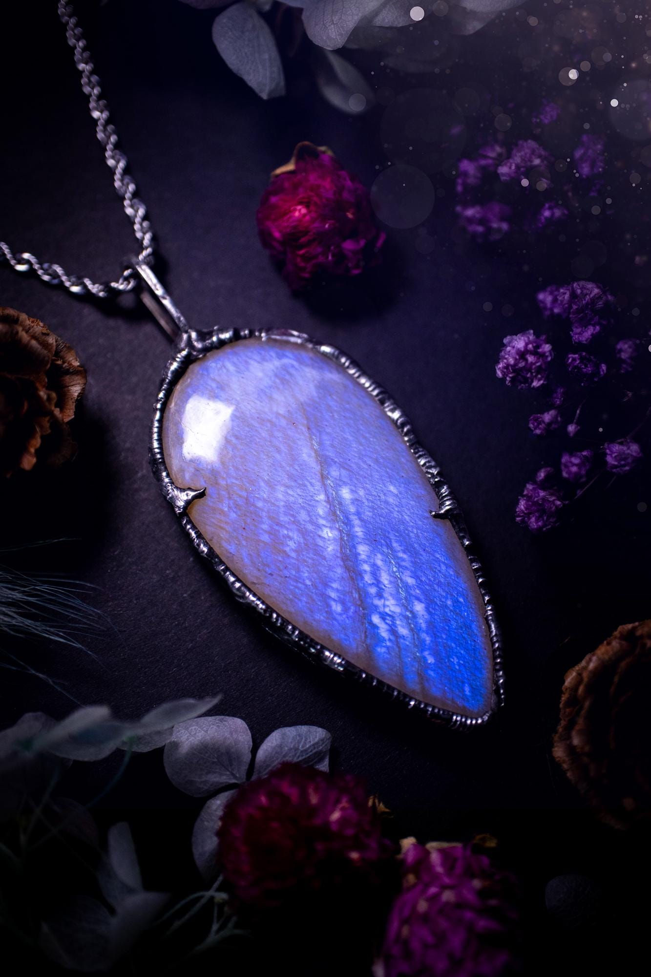 Handmade and beautiful, flashy belomorite, soft soldered pendant necklace. This pendant necklace features the most gorgeous and flashy belomorite moonstone crystal, full of glittery shimmer and a deep lovely blue hue. Handcrafted using the soft solder method, also known as the tiffany technique, an ancient technique used to created stained glass windows. The solder used is lead free and totally safe to wear, it contains elements of silver and polishes up to a high lustre. Gothic witchy jewellery