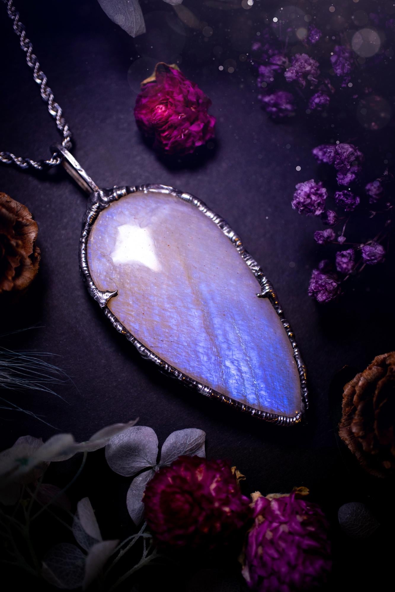 Handmade and beautiful, flashy belomorite, soft soldered pendant necklace. This pendant necklace features the most gorgeous and flashy belomorite moonstone crystal, full of glittery shimmer and a deep lovely blue hue. Handcrafted using the soft solder method, also known as the tiffany technique, an ancient technique used to created stained glass windows. The solder used is lead free and totally safe to wear, it contains elements of silver and polishes up to a high lustre. Gothic witchy jewellery
