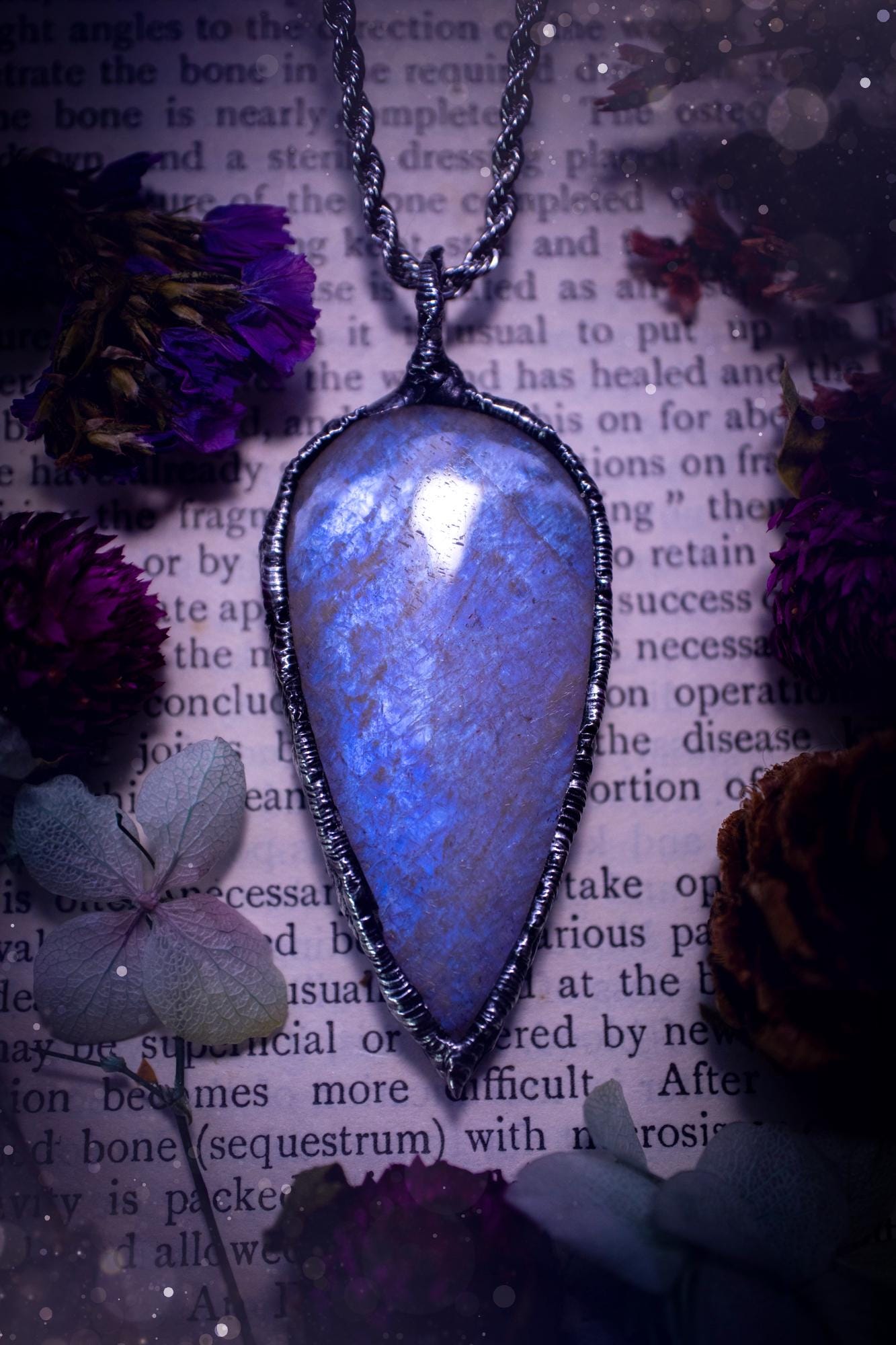 Handmade and beautiful, flashy belomorite, soft soldered pendant necklace. This pendant necklace features the most gorgeous and flashy belomorite moonstone crystal, full of glittery shimmer and a deep lovely blue hue. Handcrafted using the soft solder method, also known as the tiffany technique, an ancient technique used to created stained glass windows. The solder used is lead free and totally safe to wear, it contains elements of silver and polishes up to a high lustre. Gothic witchy jewellery