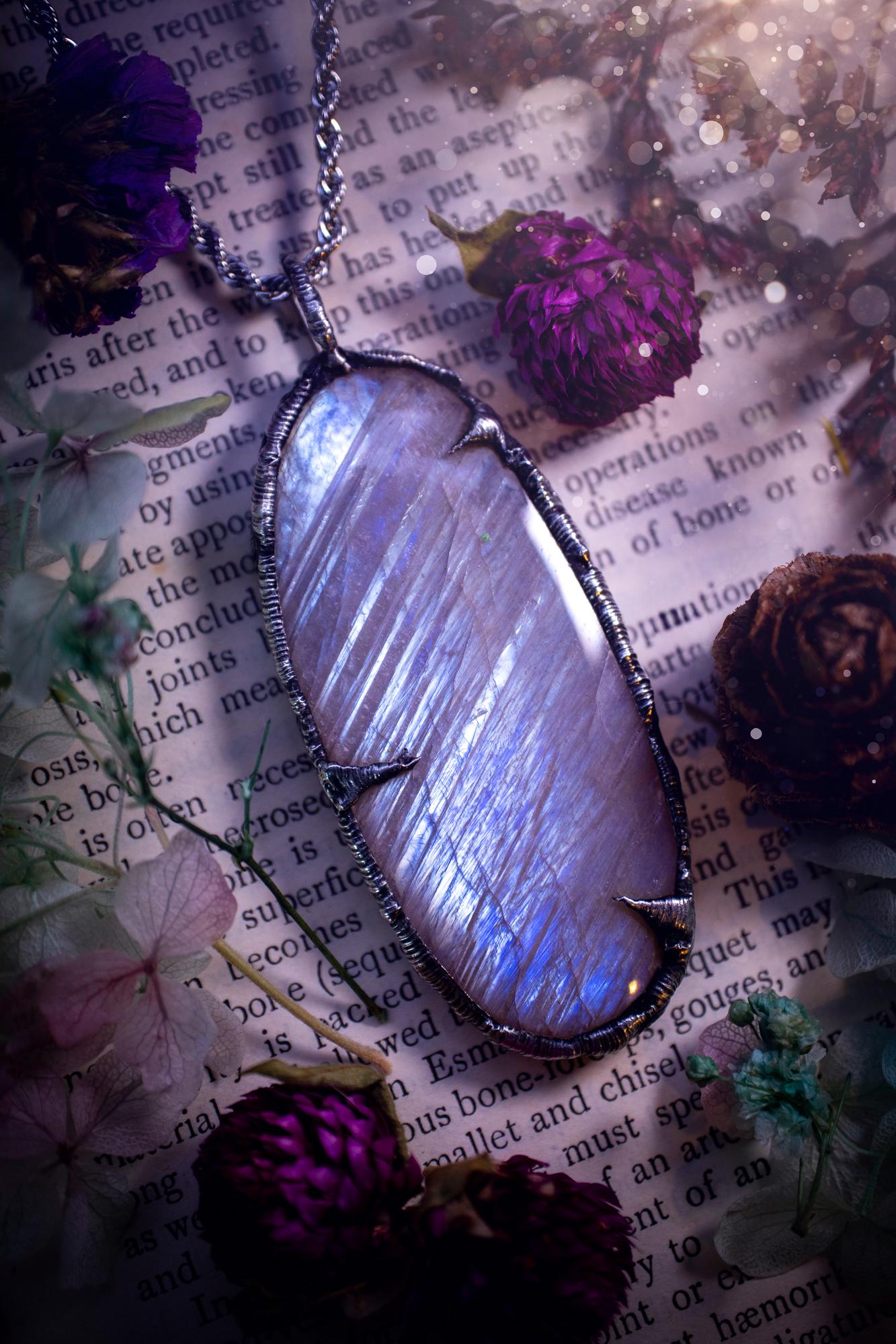 Handmade and beautiful, flashy belomorite, soft soldered pendant necklace. This pendant necklace features the most gorgeous and flashy belomorite moonstone crystal, full of glittery shimmer and a deep lovely blue hue. Handcrafted using the soft solder method, also known as the tiffany technique, an ancient technique used to created stained glass windows. The solder used is lead free and totally safe to wear, it contains elements of silver and polishes up to a high lustre. Gothic witchy jewellery
