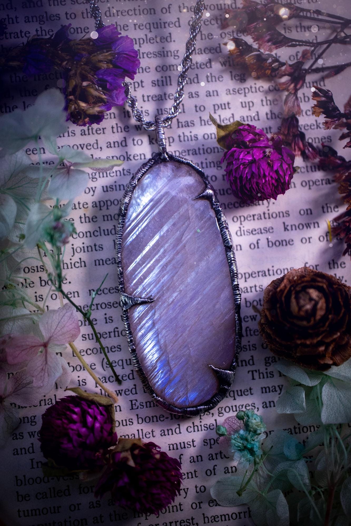Handmade and beautiful, flashy belomorite, soft soldered pendant necklace. This pendant necklace features the most gorgeous and flashy belomorite moonstone crystal, full of glittery shimmer and a deep lovely blue hue. Handcrafted using the soft solder method, also known as the tiffany technique, an ancient technique used to created stained glass windows. The solder used is lead free and totally safe to wear, it contains elements of silver and polishes up to a high lustre. Gothic witchy jewellery