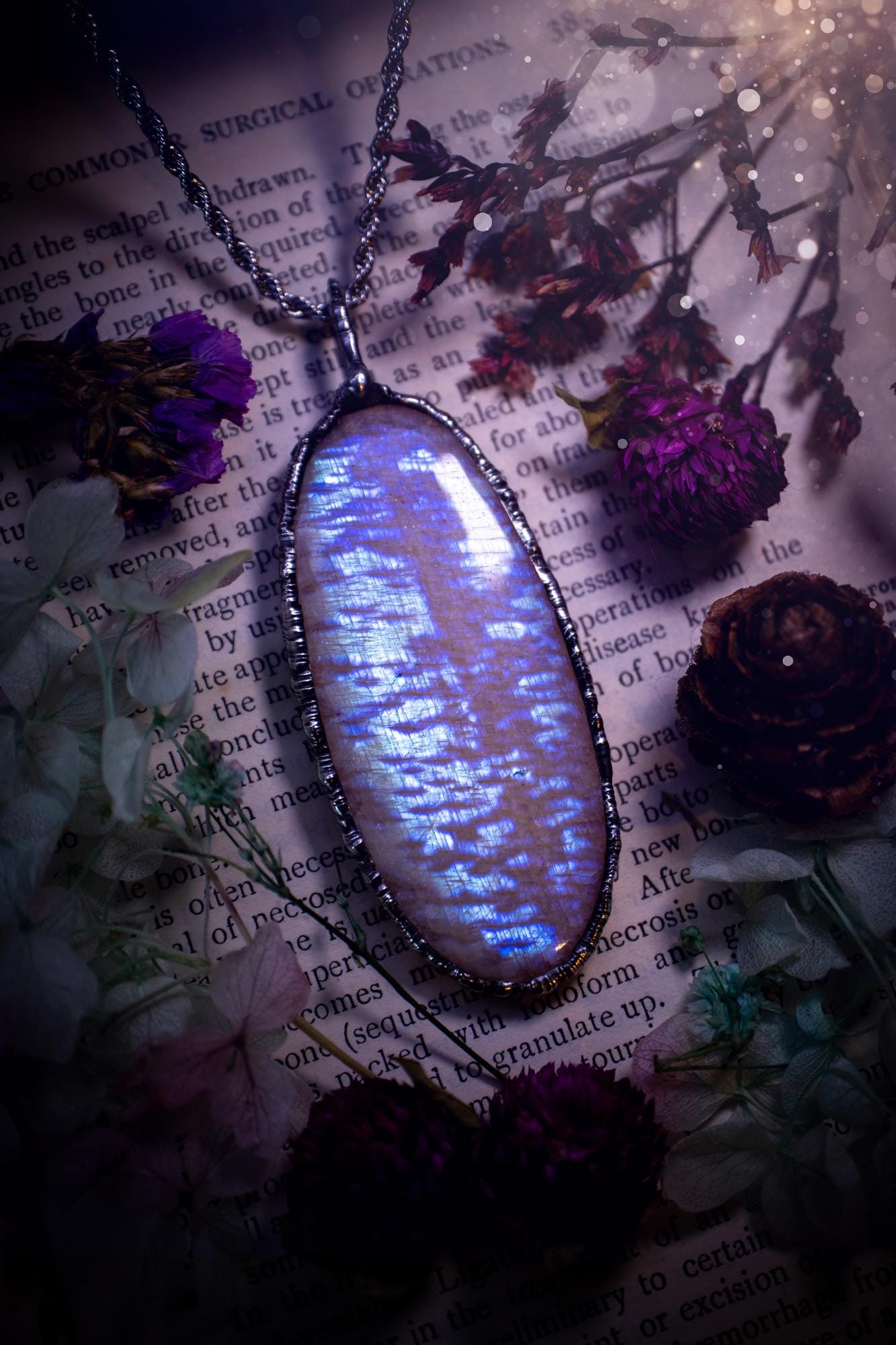 Handmade and beautiful, flashy belomorite, soft soldered pendant necklace. This pendant necklace features the most gorgeous and flashy belomorite moonstone crystal, full of glittery shimmer and a deep lovely blue hue. Handcrafted using the soft solder method, also known as the tiffany technique, an ancient technique used to created stained glass windows. The solder used is lead free and totally safe to wear, it contains elements of silver and polishes up to a high lustre. Gothic witchy jewellery