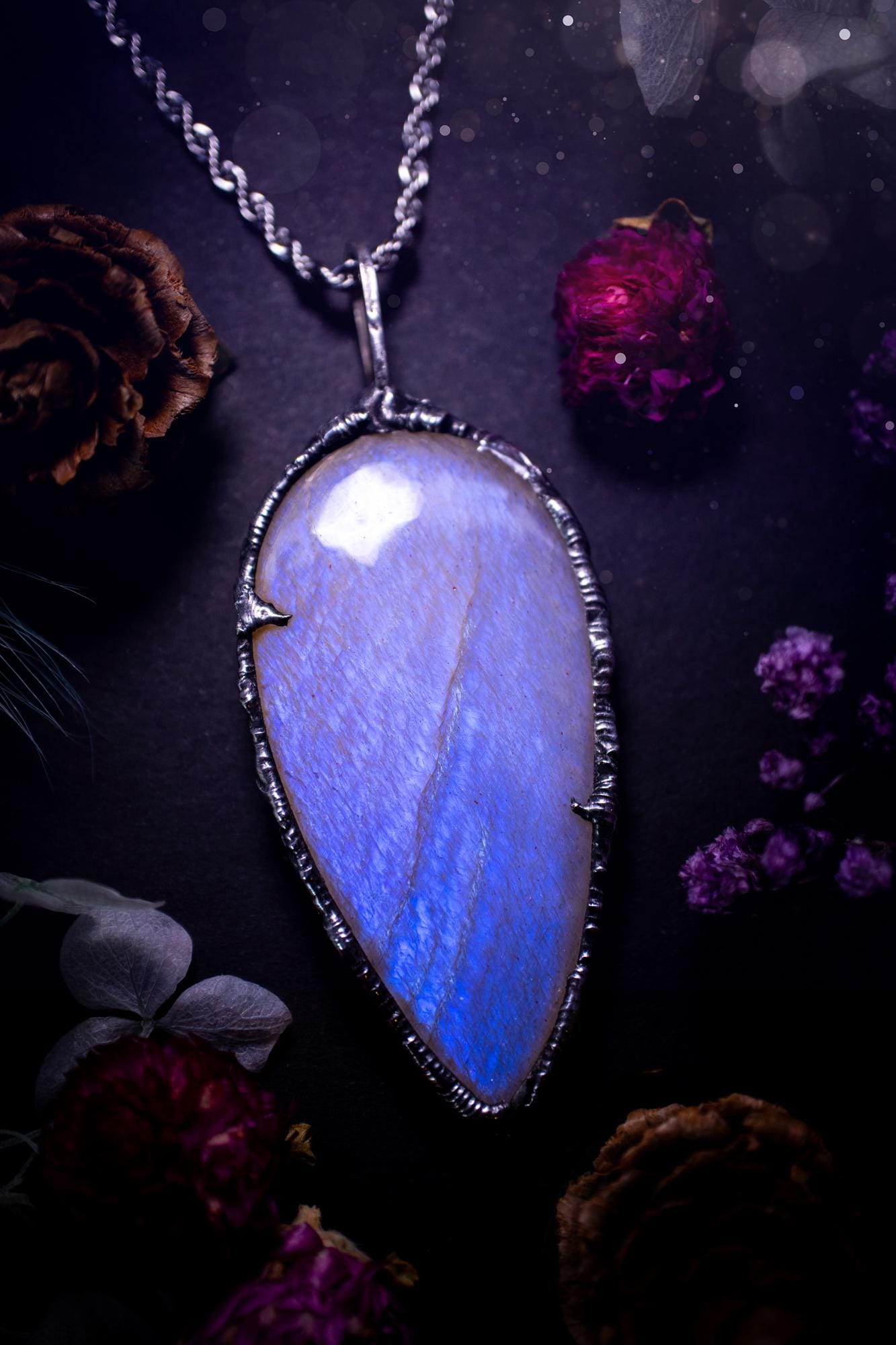Handmade and beautiful, flashy belomorite, soft soldered pendant necklace. This pendant necklace features the most gorgeous and flashy belomorite moonstone crystal, full of glittery shimmer and a deep lovely blue hue. Handcrafted using the soft solder method, also known as the tiffany technique, an ancient technique used to created stained glass windows. The solder used is lead free and totally safe to wear, it contains elements of silver and polishes up to a high lustre. Gothic witchy jewellery