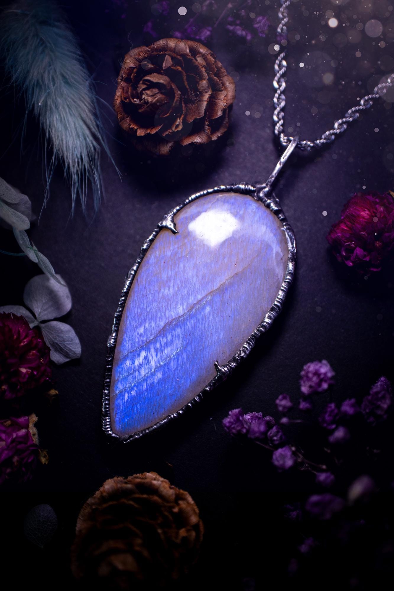 Handmade and beautiful, flashy belomorite, soft soldered pendant necklace. This pendant necklace features the most gorgeous and flashy belomorite moonstone crystal, full of glittery shimmer and a deep lovely blue hue. Handcrafted using the soft solder method, also known as the tiffany technique, an ancient technique used to created stained glass windows. The solder used is lead free and totally safe to wear, it contains elements of silver and polishes up to a high lustre. Gothic witchy jewellery