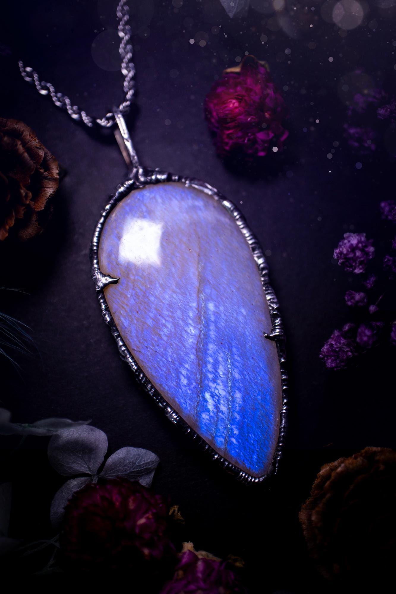 Handmade and beautiful, flashy belomorite, soft soldered pendant necklace. This pendant necklace features the most gorgeous and flashy belomorite moonstone crystal, full of glittery shimmer and a deep lovely blue hue. Handcrafted using the soft solder method, also known as the tiffany technique, an ancient technique used to created stained glass windows. The solder used is lead free and totally safe to wear, it contains elements of silver and polishes up to a high lustre. Gothic witchy jewellery
